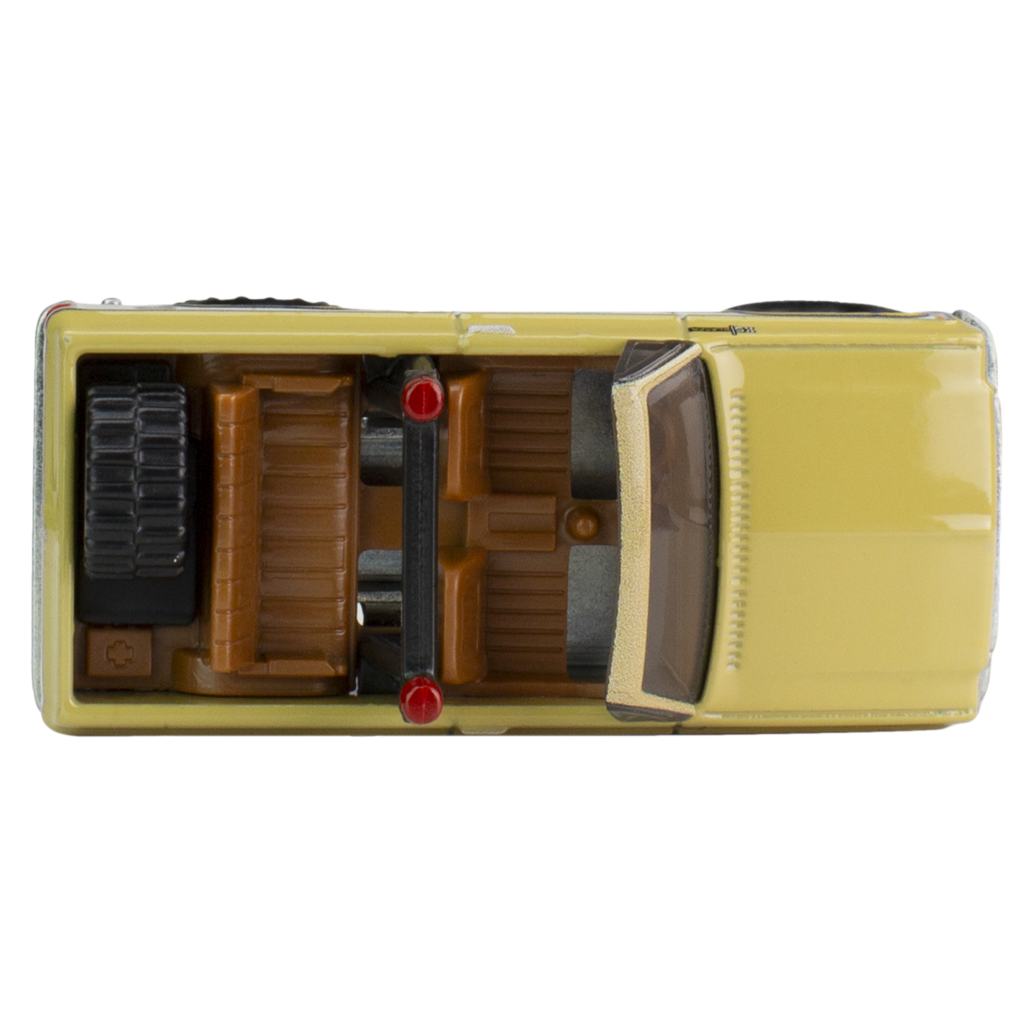 Widok z góry na żółtą zabawkę ciężarówki z brązowym wnętrzem i czarnymi oponami. Widoczne czerwone światła.