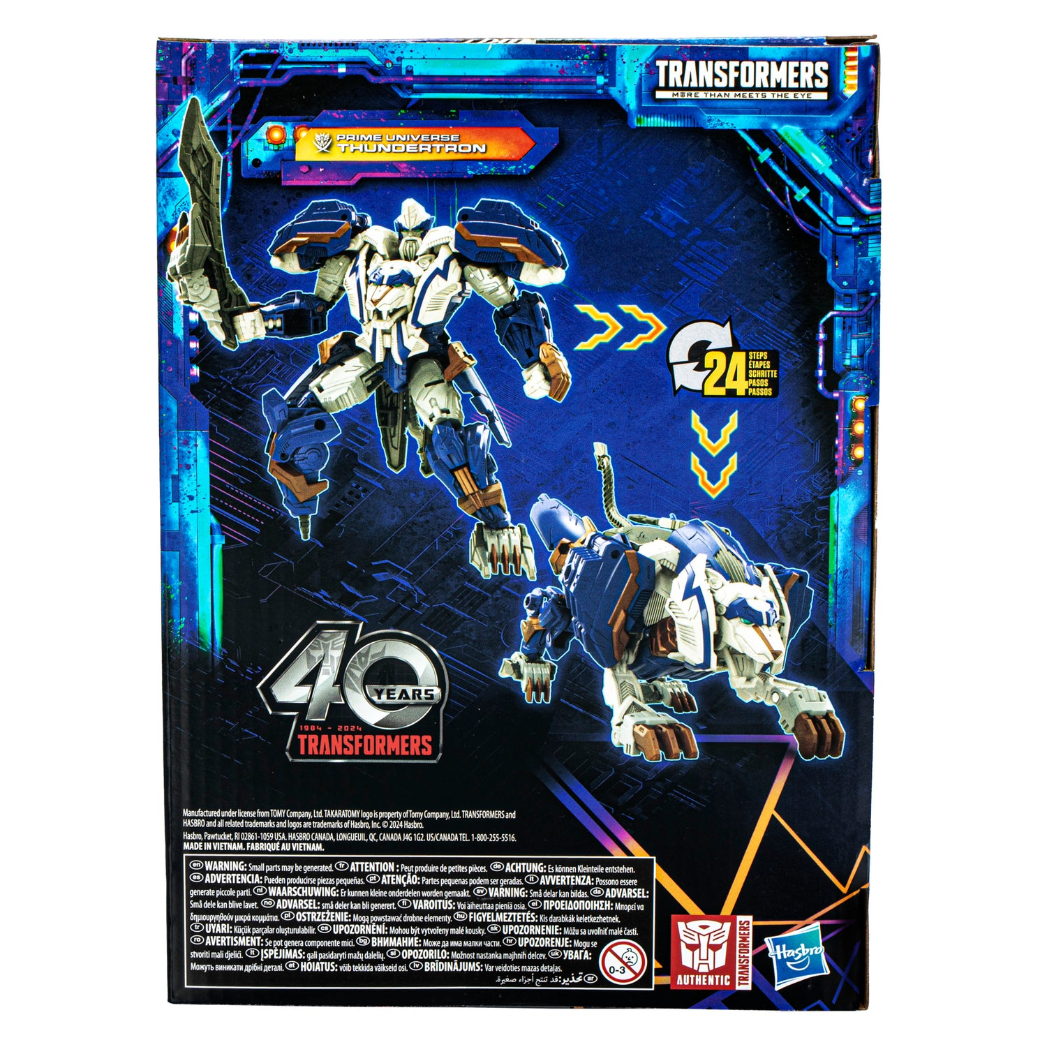 Scatola giocattolo Transformers con figure di robot e leone, colori blu e bianco, logo 40 anni Transformers.