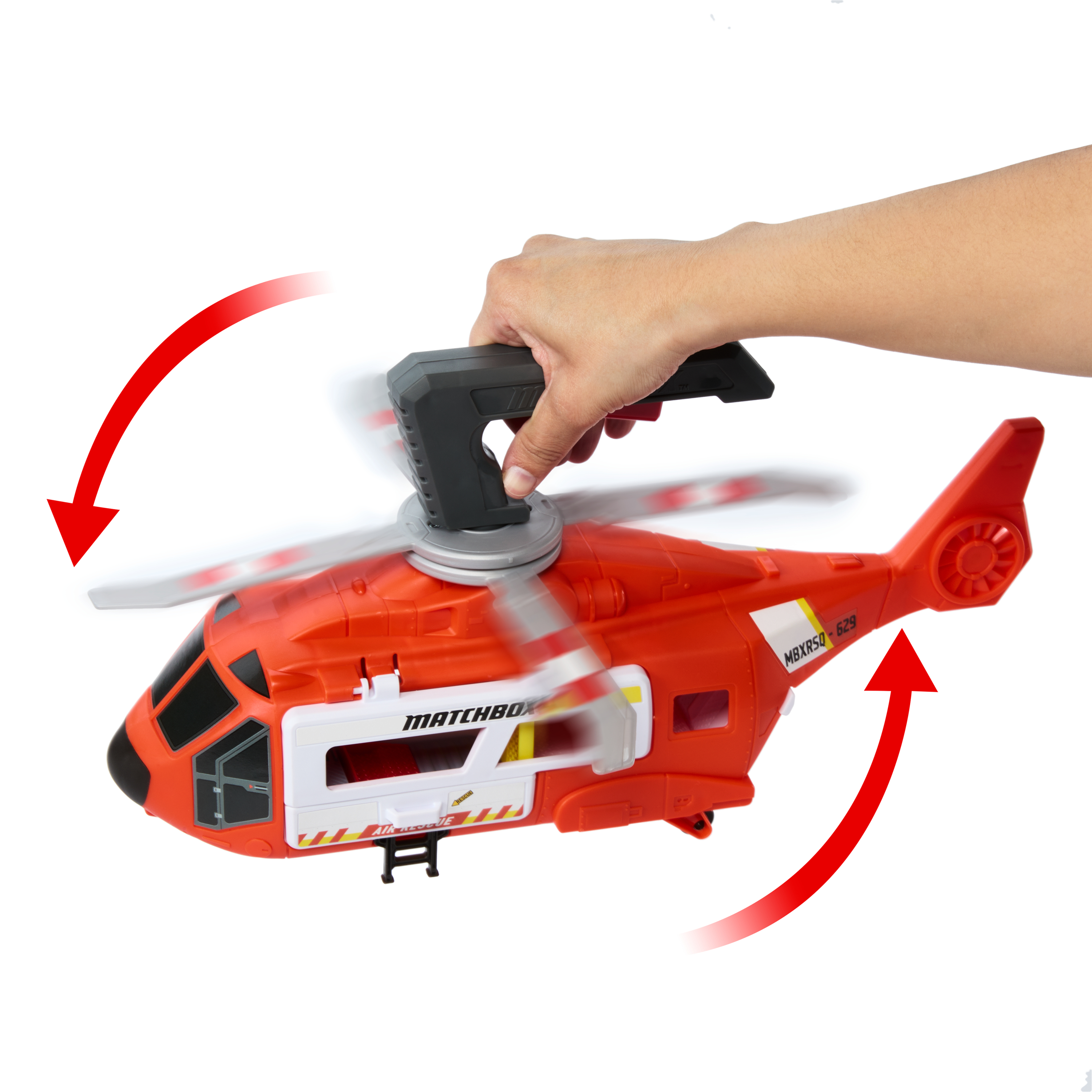 Pomarańczowy helikopter zabawkowy jest trzymany przez dłoń. Czerwone strzałki wskazują na i z helikoptera.