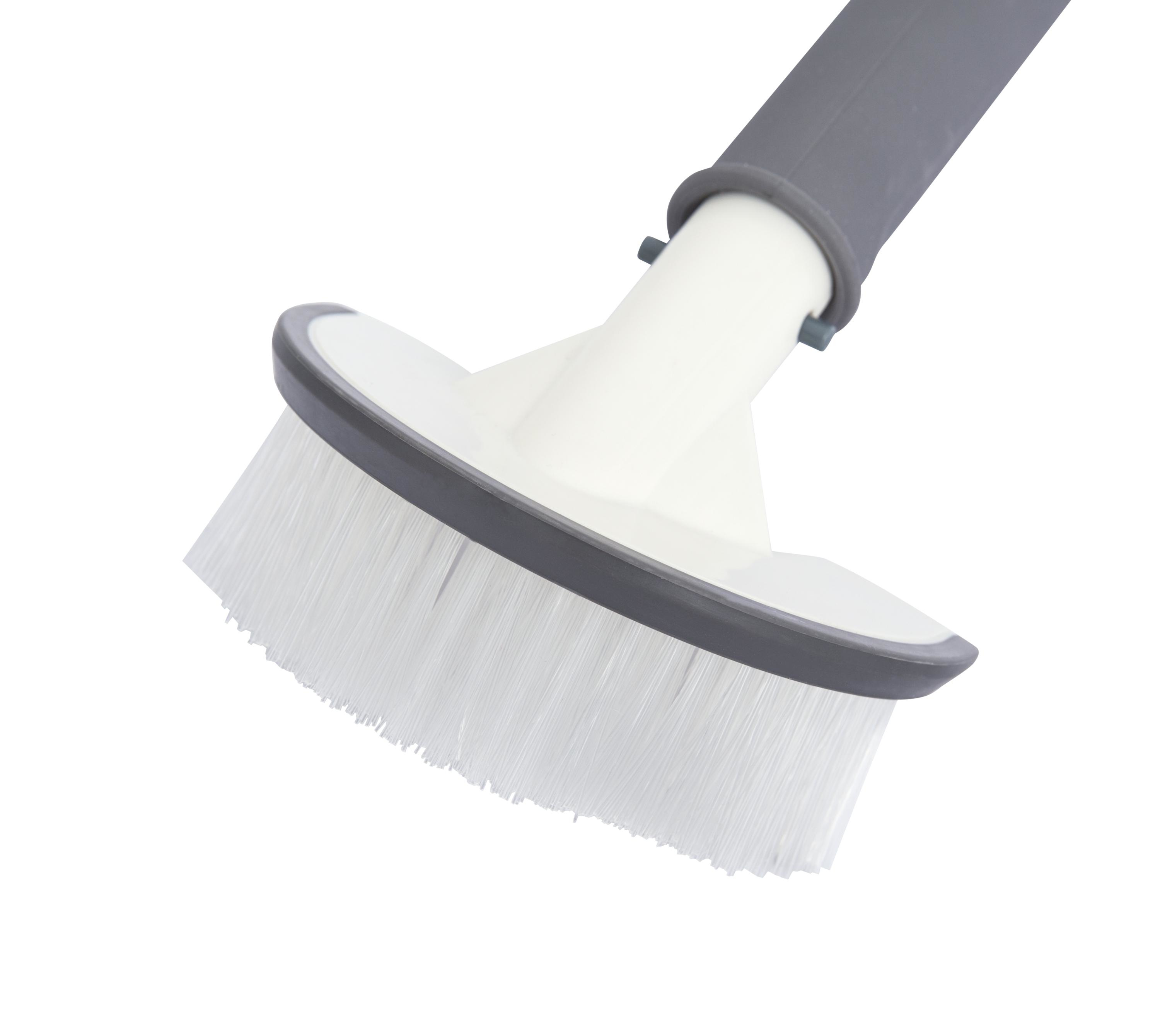 Une brosse blanche et grise sur fond blanc. La tête de brosse est blanche avec garniture et soies grises.