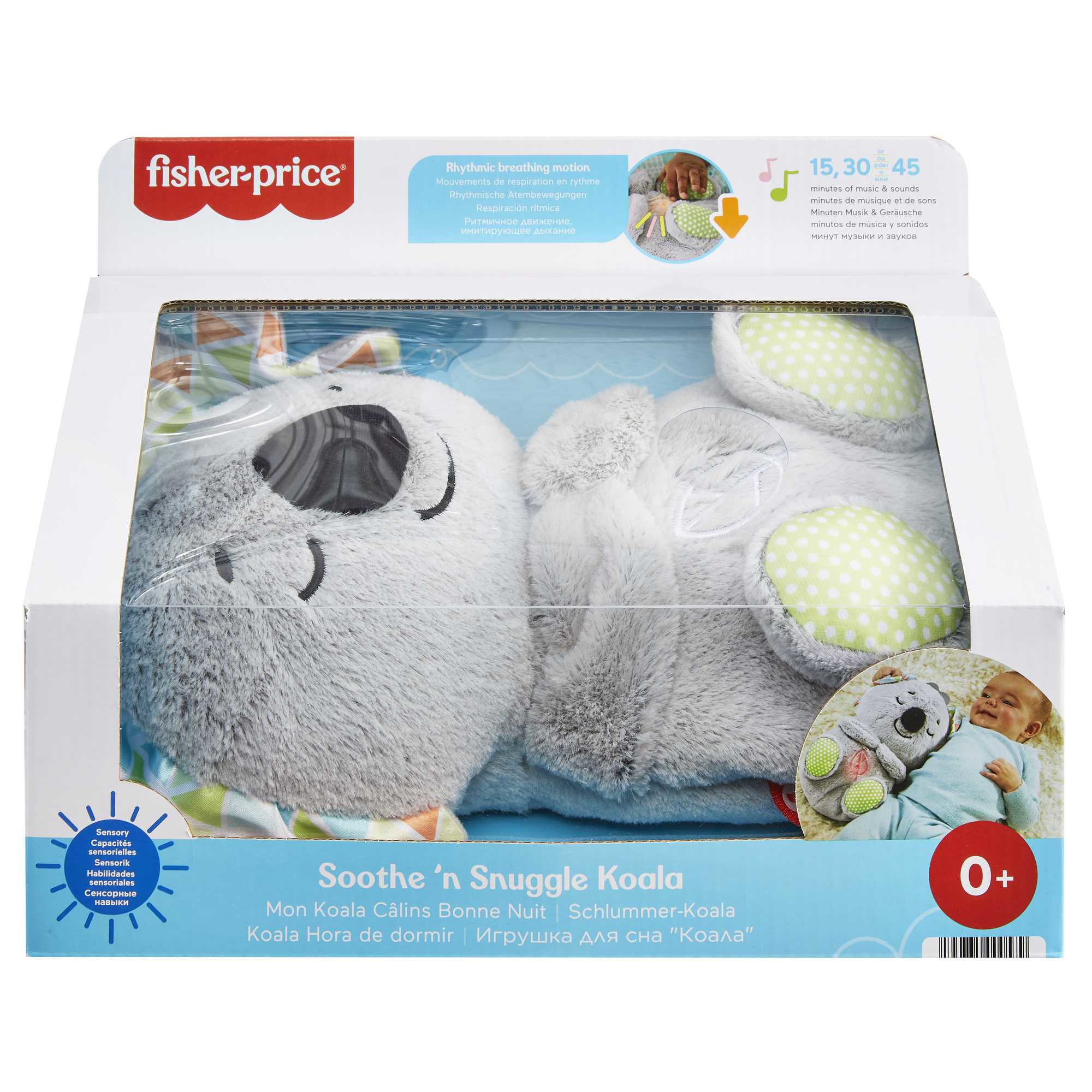 Zabawka Fisher-Price Soothe 'n Snuggle Koala w pudełku. Ma szare futro, zielone akcenty i dziecko na pudełku.