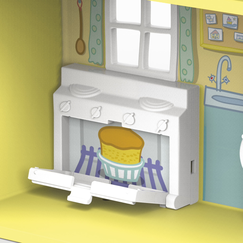 Una escena de cocina de juguete. Un pastel está en el horno. Hay una ventana, un fregadero y armarios. Las paredes son amarillas.