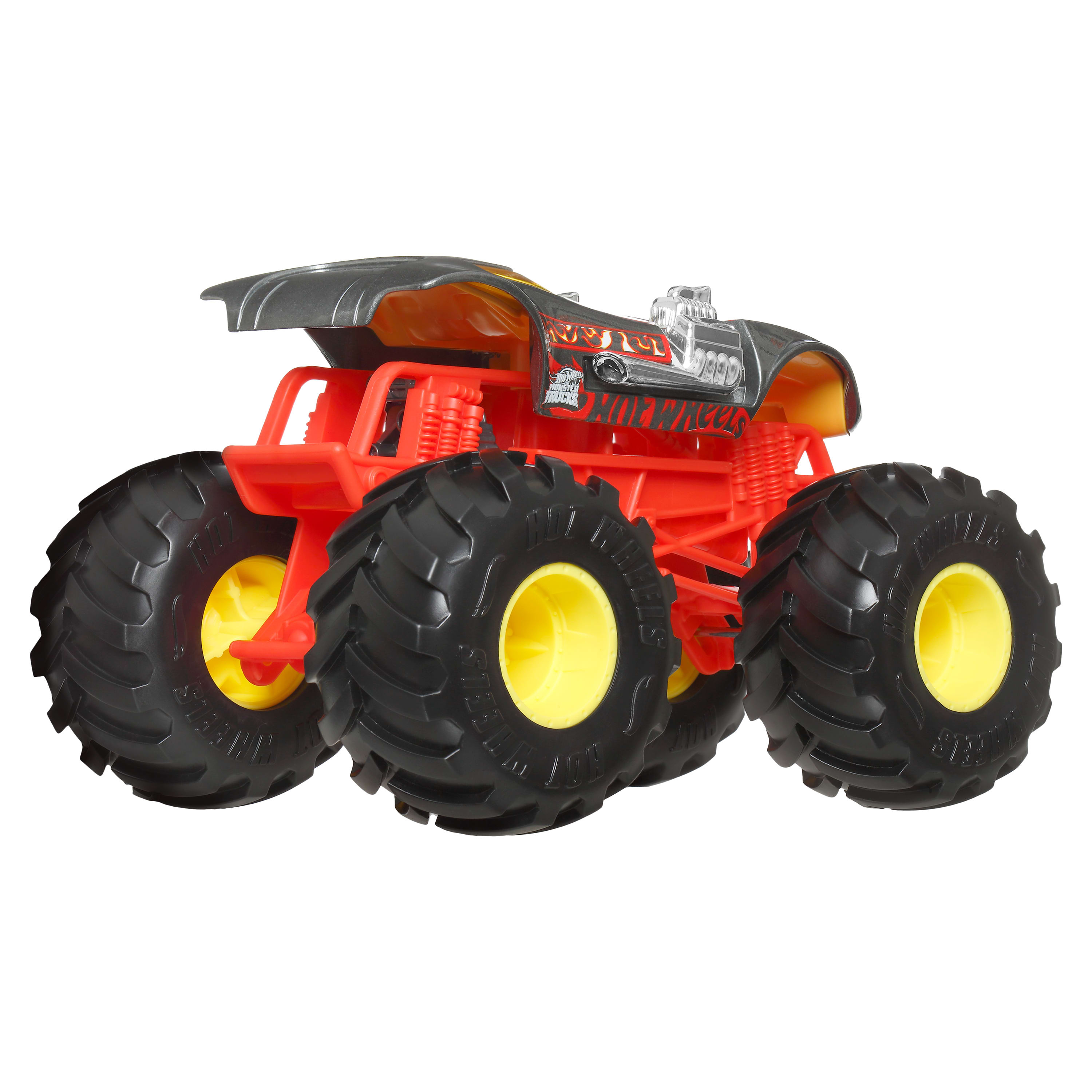 Ein rotes und schwarzes Hot Wheels Monster Truck Spielzeug mit großen schwarzen Reifen und gelben Felgen auf weißem Grund.