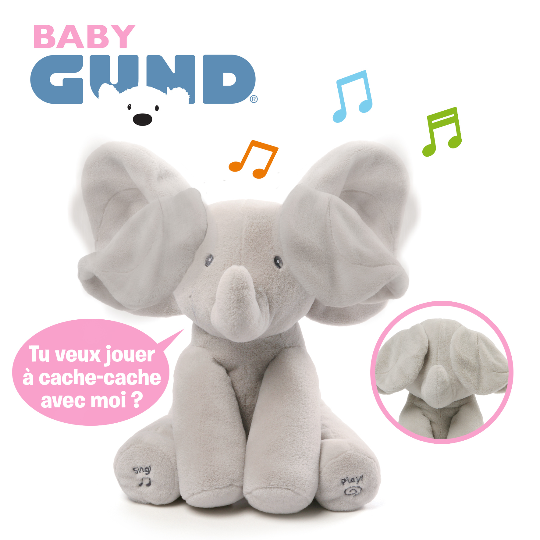 Szara pluszowa zabawka słonia z dużymi uszami. Ma nuty i dymek z pytaniem o zabawę w chowanego.