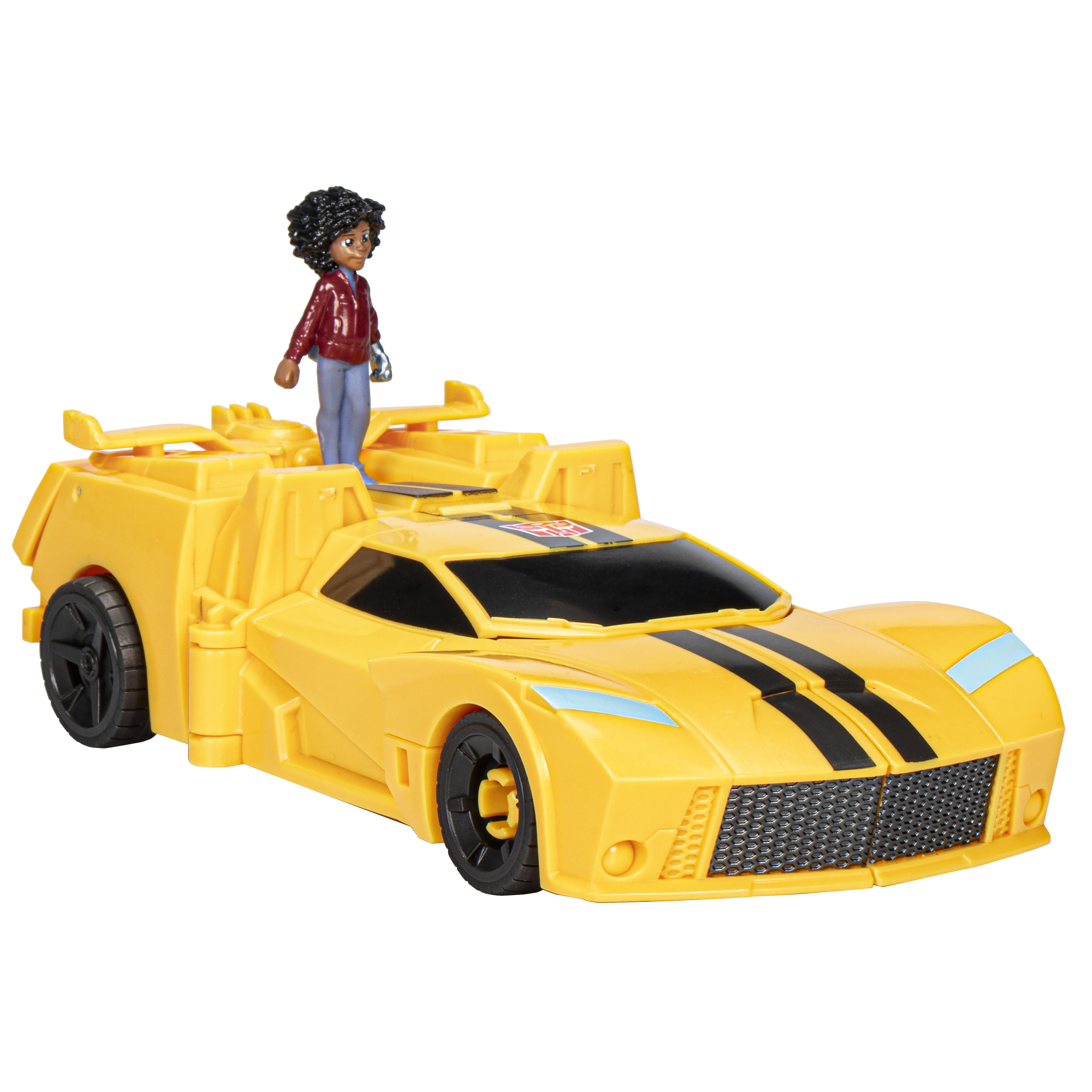 Un coche de juguete amarillo con rayas negras y una figura de pie encima. El coche tiene ruedas negras.