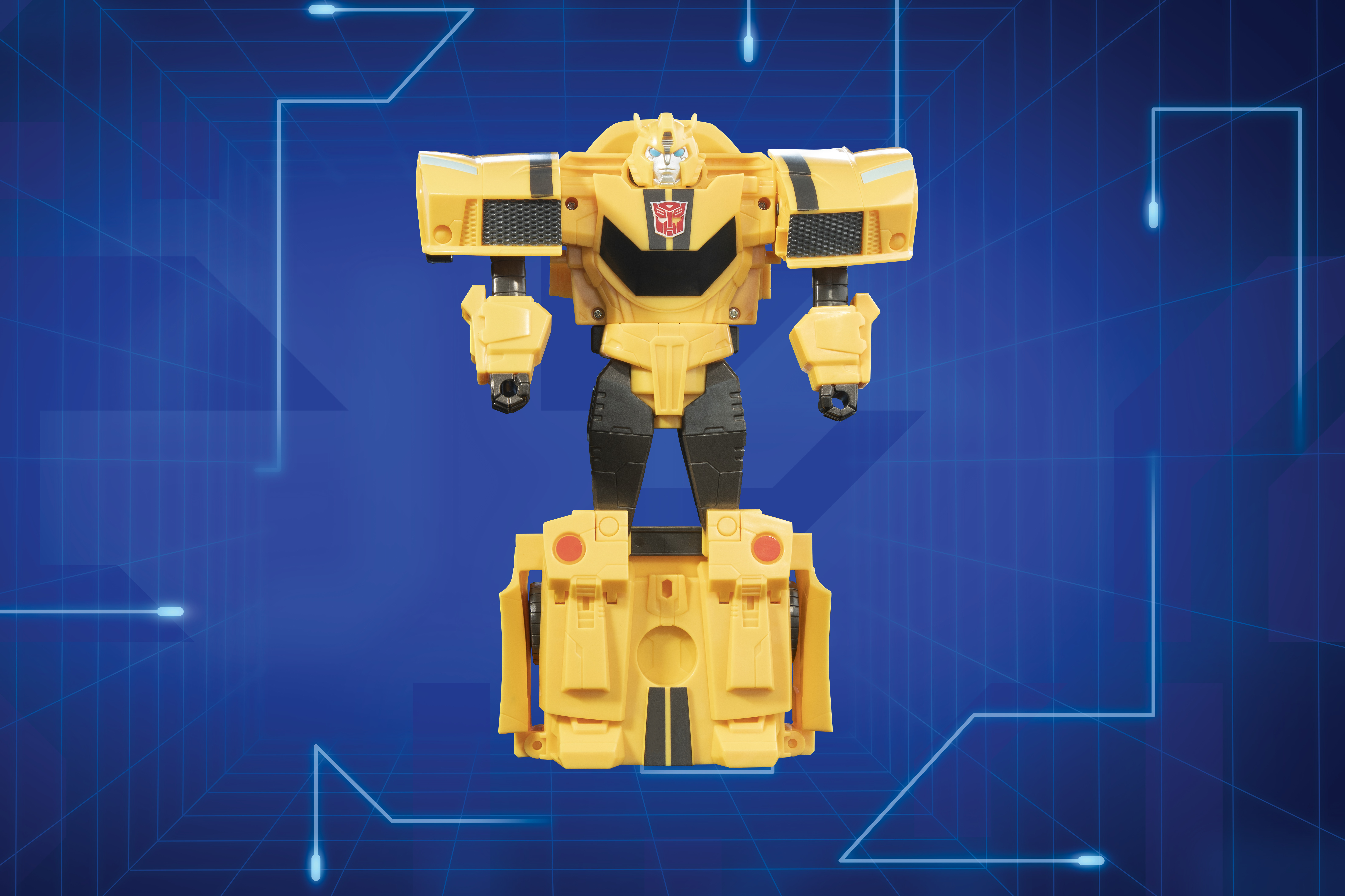 Juguete Transformer amarillo sobre fondo azul. Detalles en negro y amarillo. Logotipo Autobot.