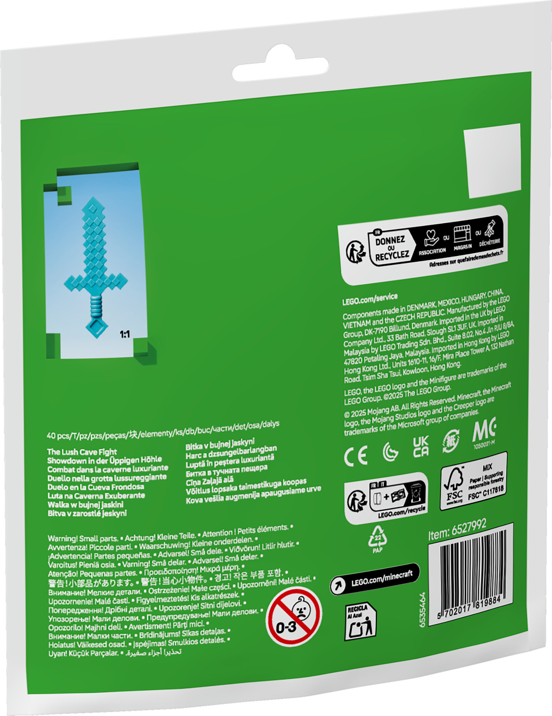 Opakowanie z ilustracją miecza Minecraft, zielonym tłem i różnymi etykietami.