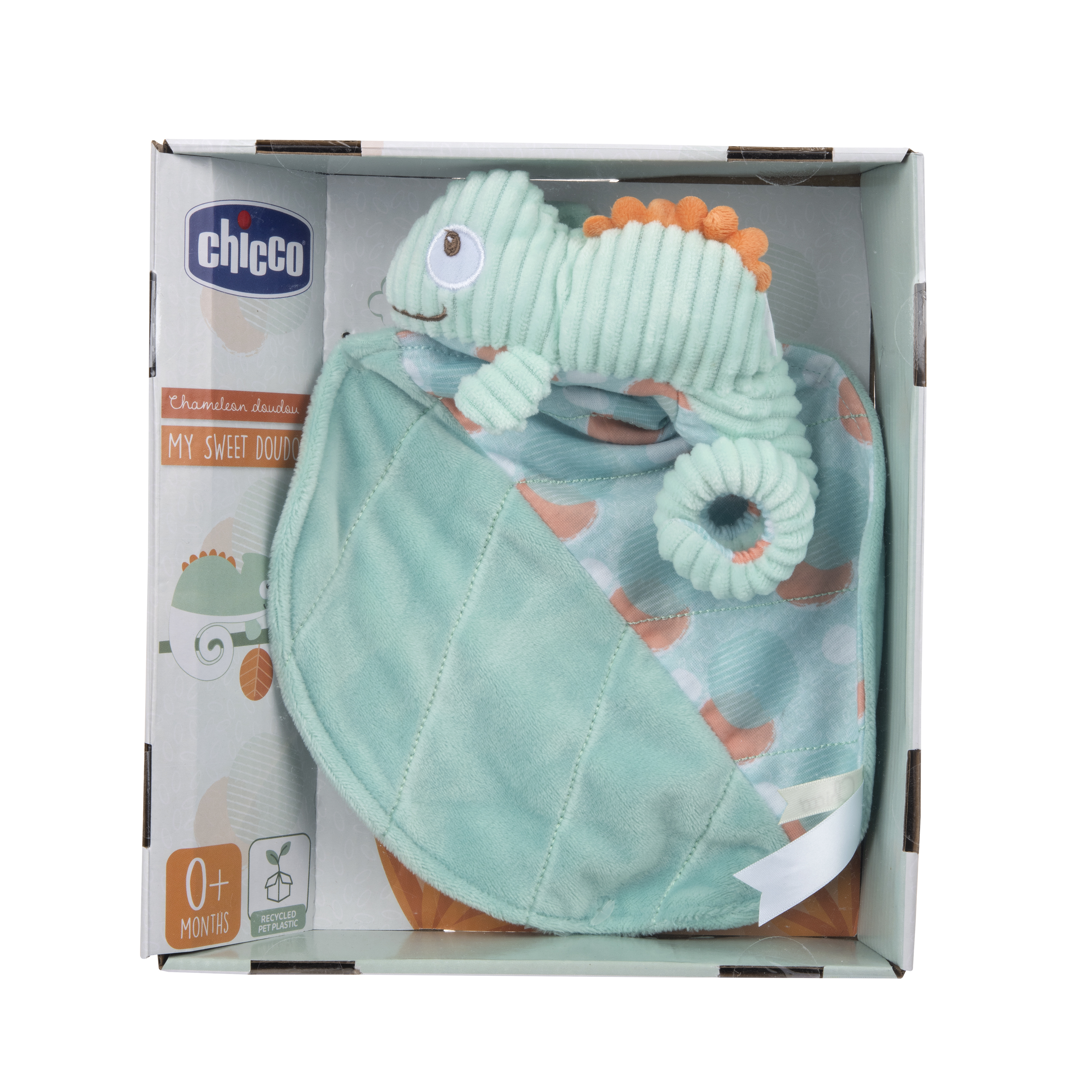 Zabawka dla dziecka w pudełku. To zielona zabawka-kameleon i zielony kocyk we wzory.