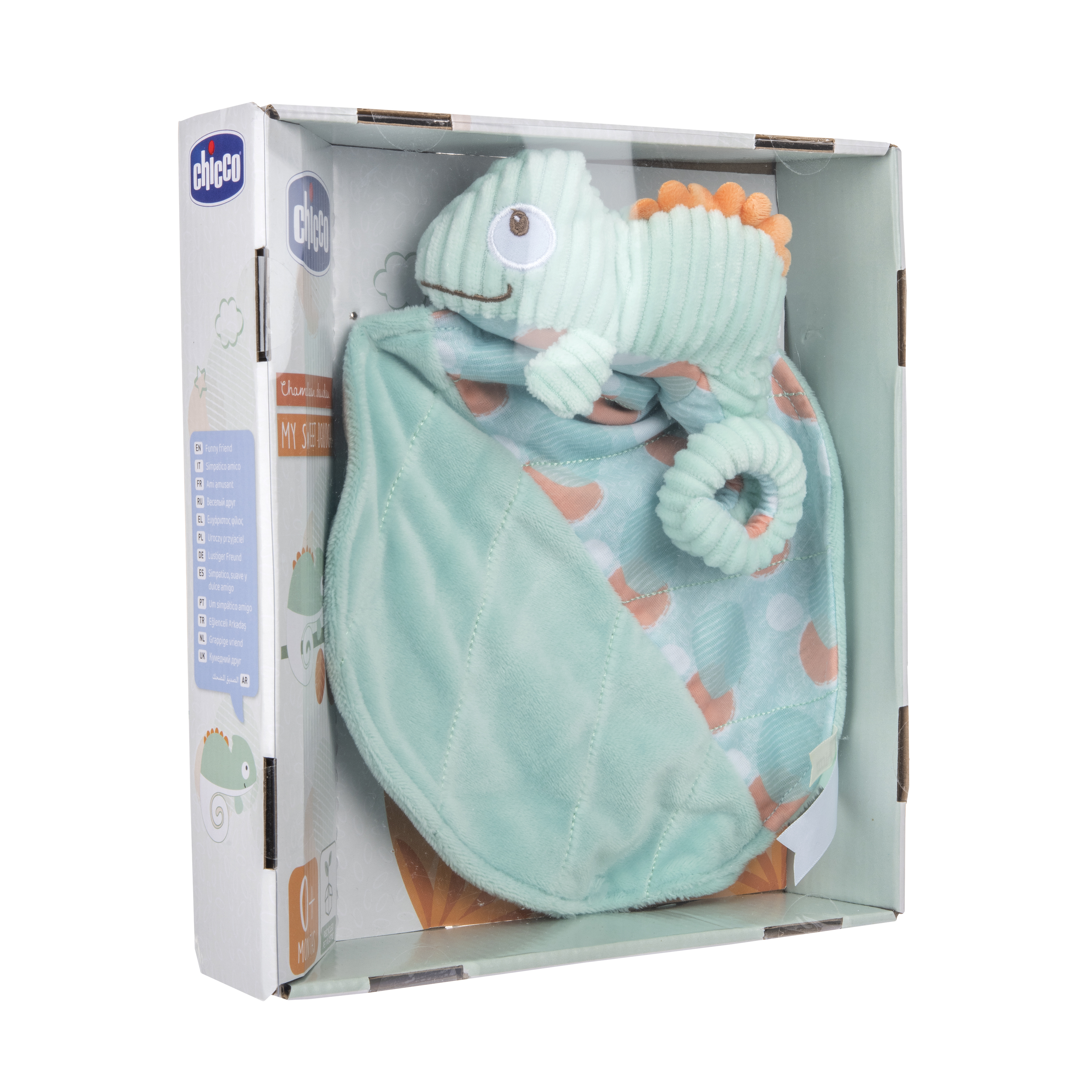 Miękka zabawka-kameleon i kocyk znajdują się w pudełku. Zabawka jest miętowo-zielona z pomarańczowymi detalami.