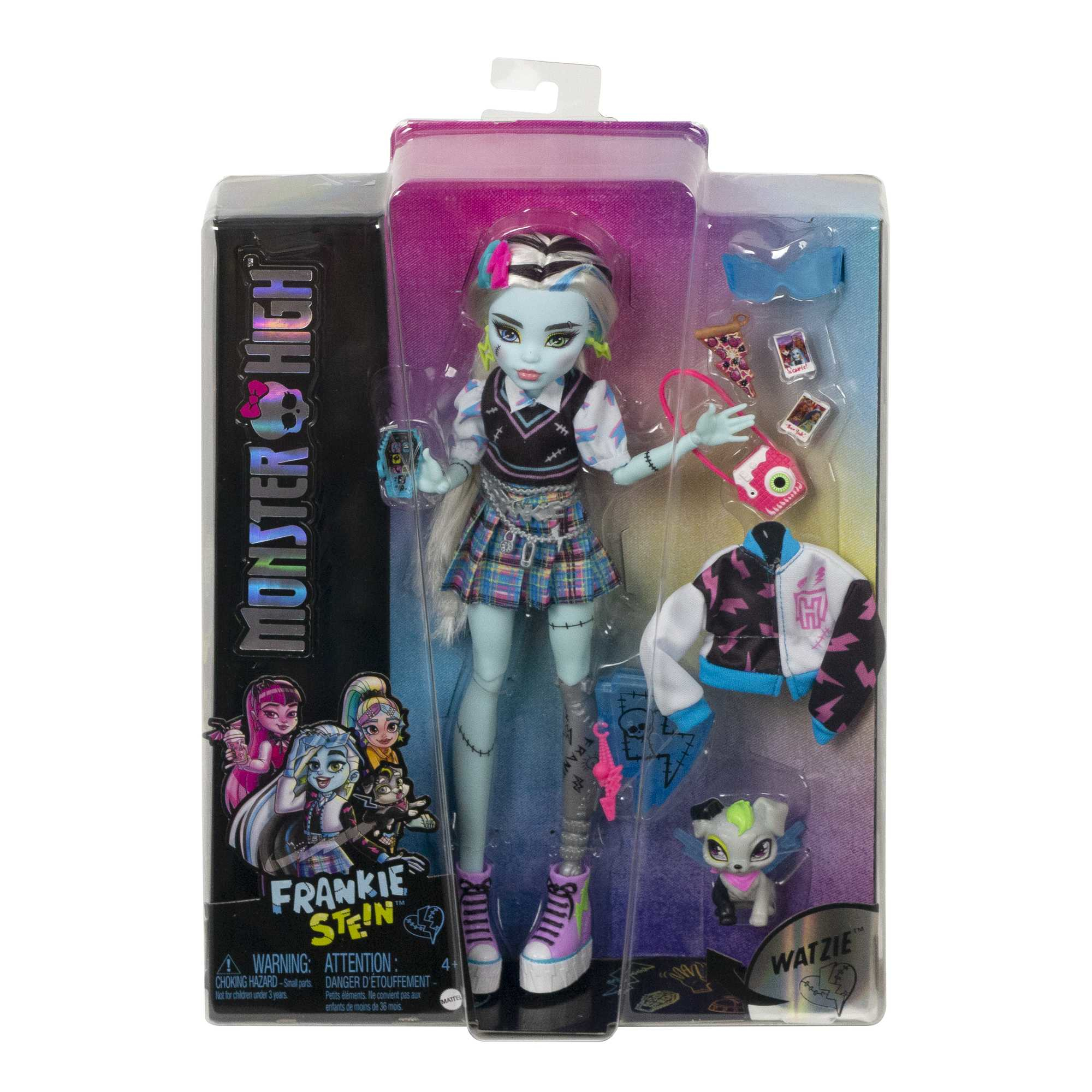 Eine Frankie Stein Puppe in der Verpackung. Zubehör umfasst eine Jacke, eine Handtasche und ein Haustier. Auf der Box steht "Monster High".