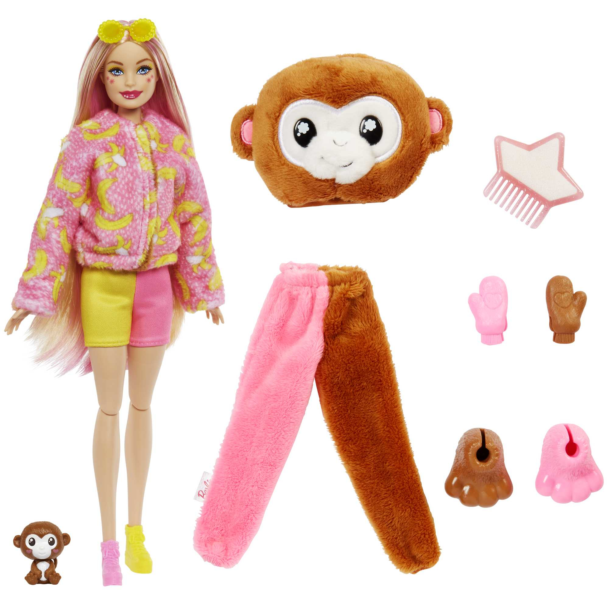 Eine Barbie-Puppe mit rosa Haaren und einer Jacke mit Bananenmuster sowie Zubehör: Affe, Hose, Kamm, Fäustlinge und Stiefel.