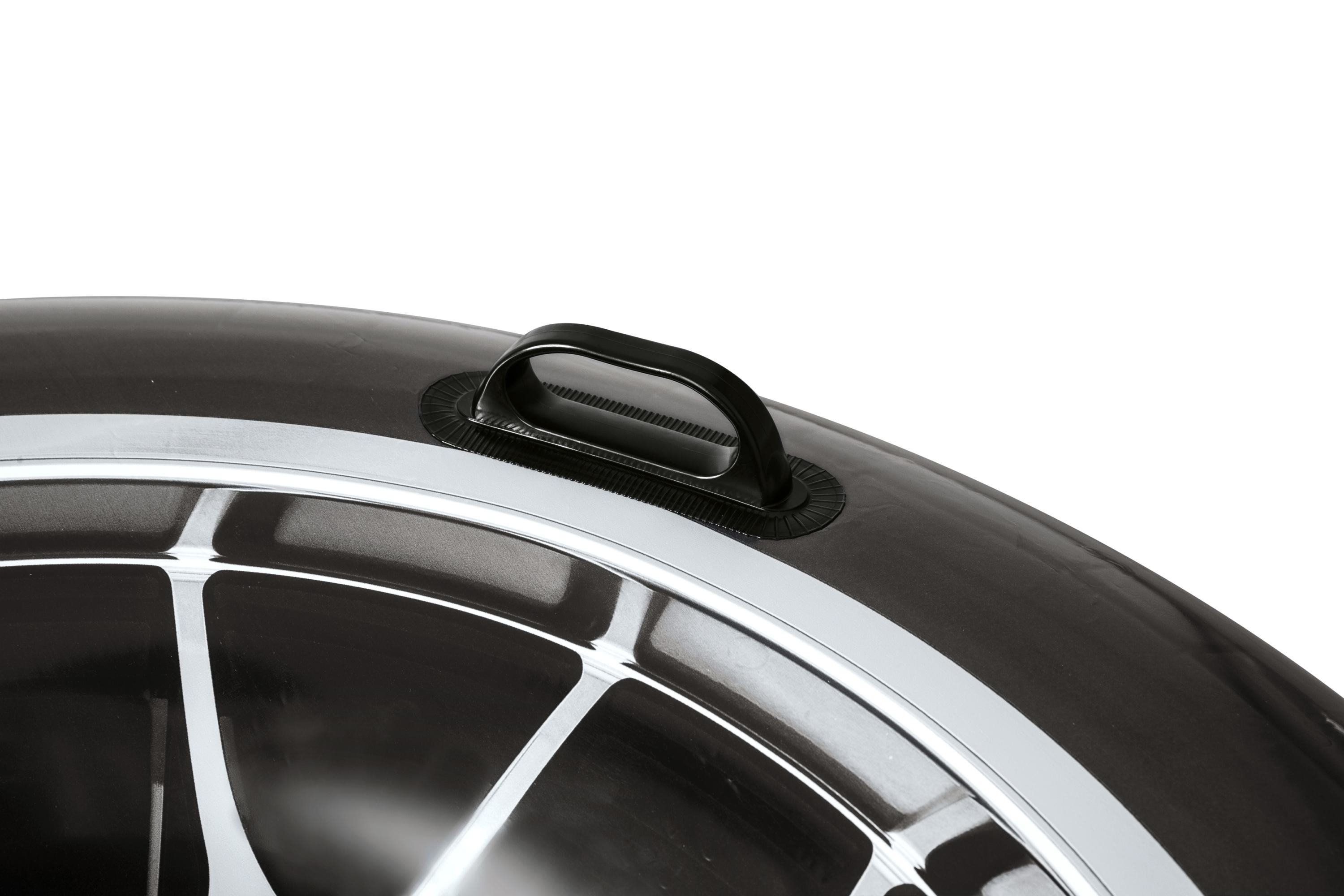 A close-up of a black inflatable ring with a black handle. White stripes are visible. Background is white.