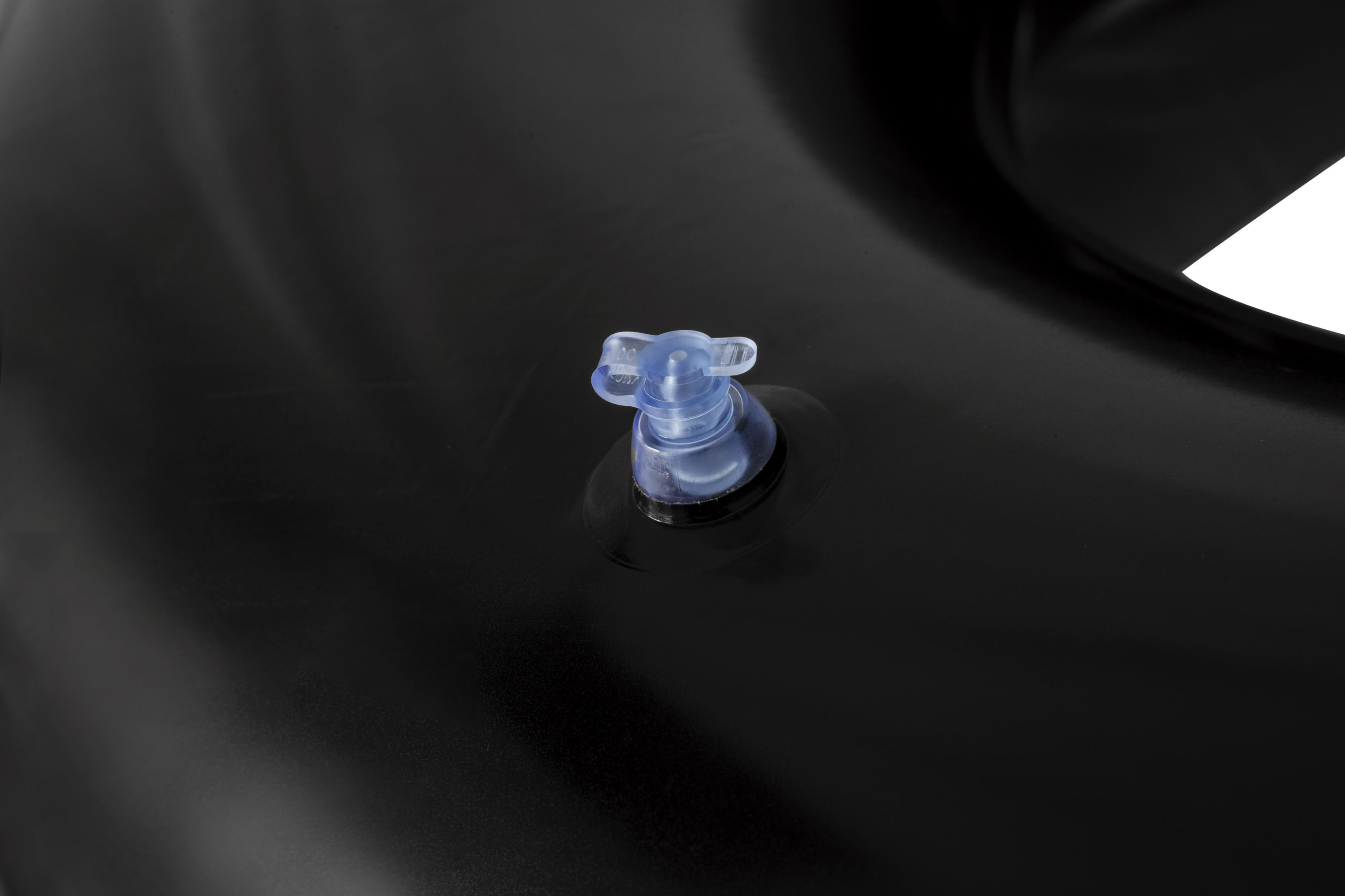 Close-up of a black inflatable object with a clear plastic valve. The valve is centered on the surface.