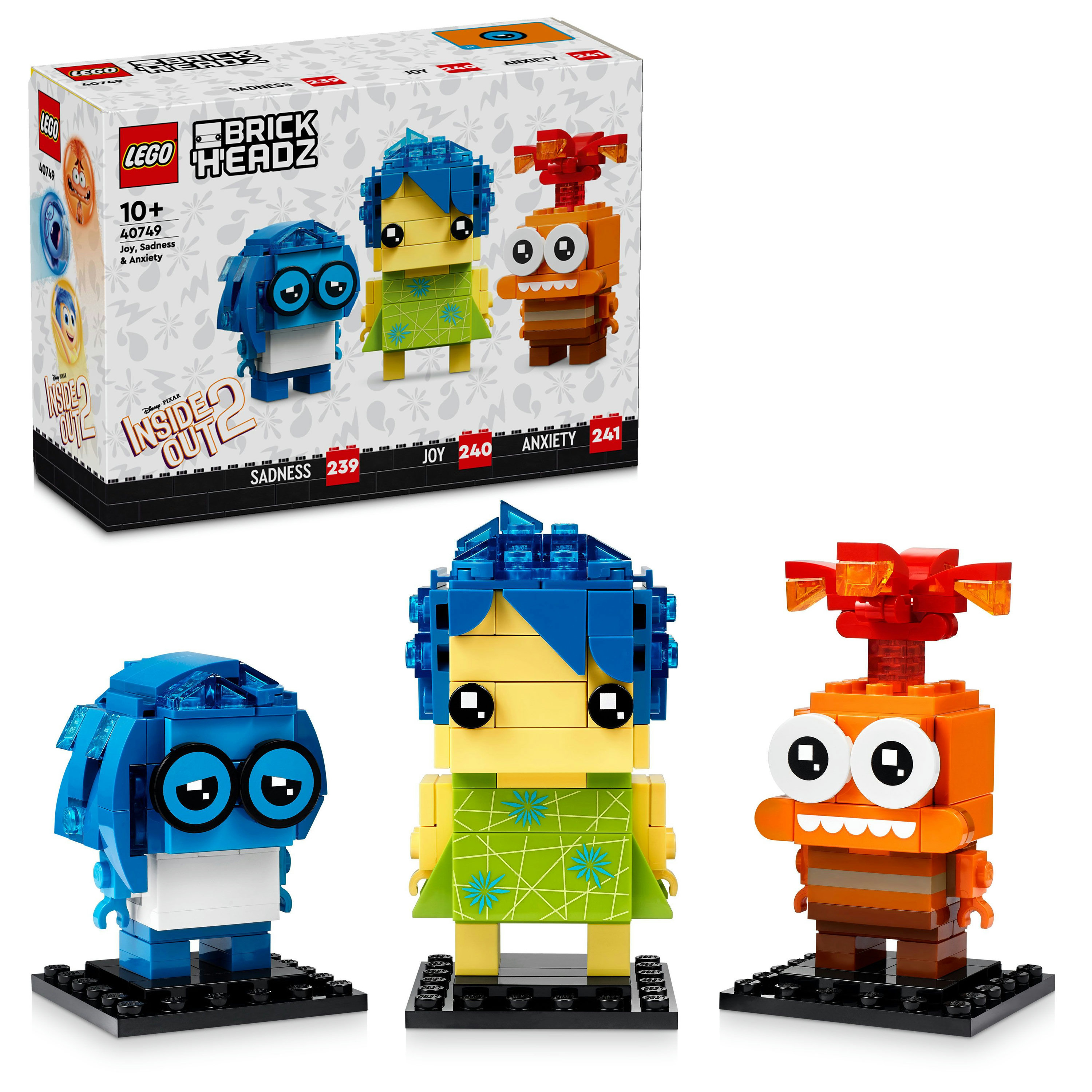 Set Lego BrickHeadz avec les personnages de Tristesse, Joie et Anxiété de Vice-Versa 2, avec une boîte en arrière-plan.