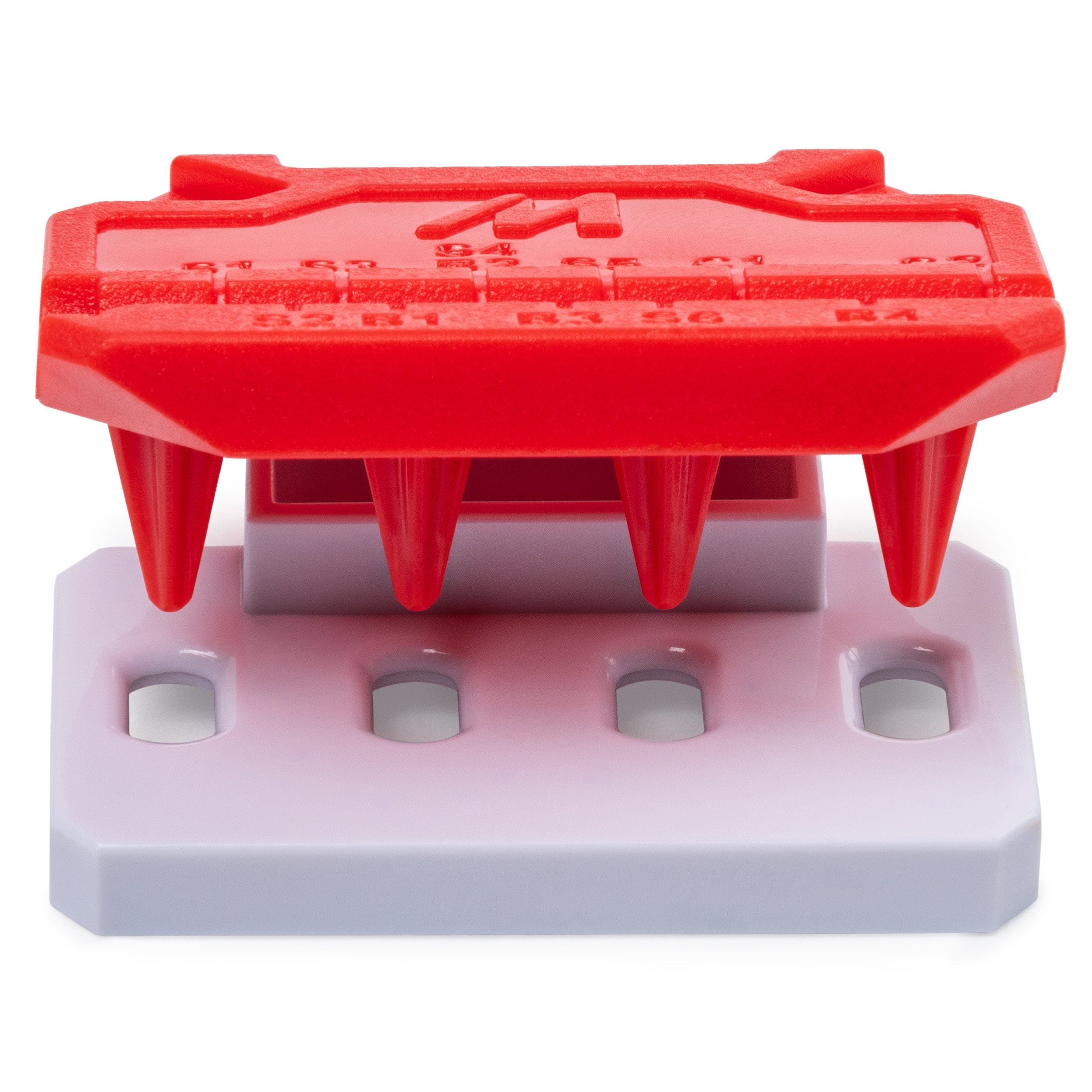 Czerwone plastikowe narzędzie z nogami na białej i szarej podstawie. Numery są wydrukowane na czerwonej części.