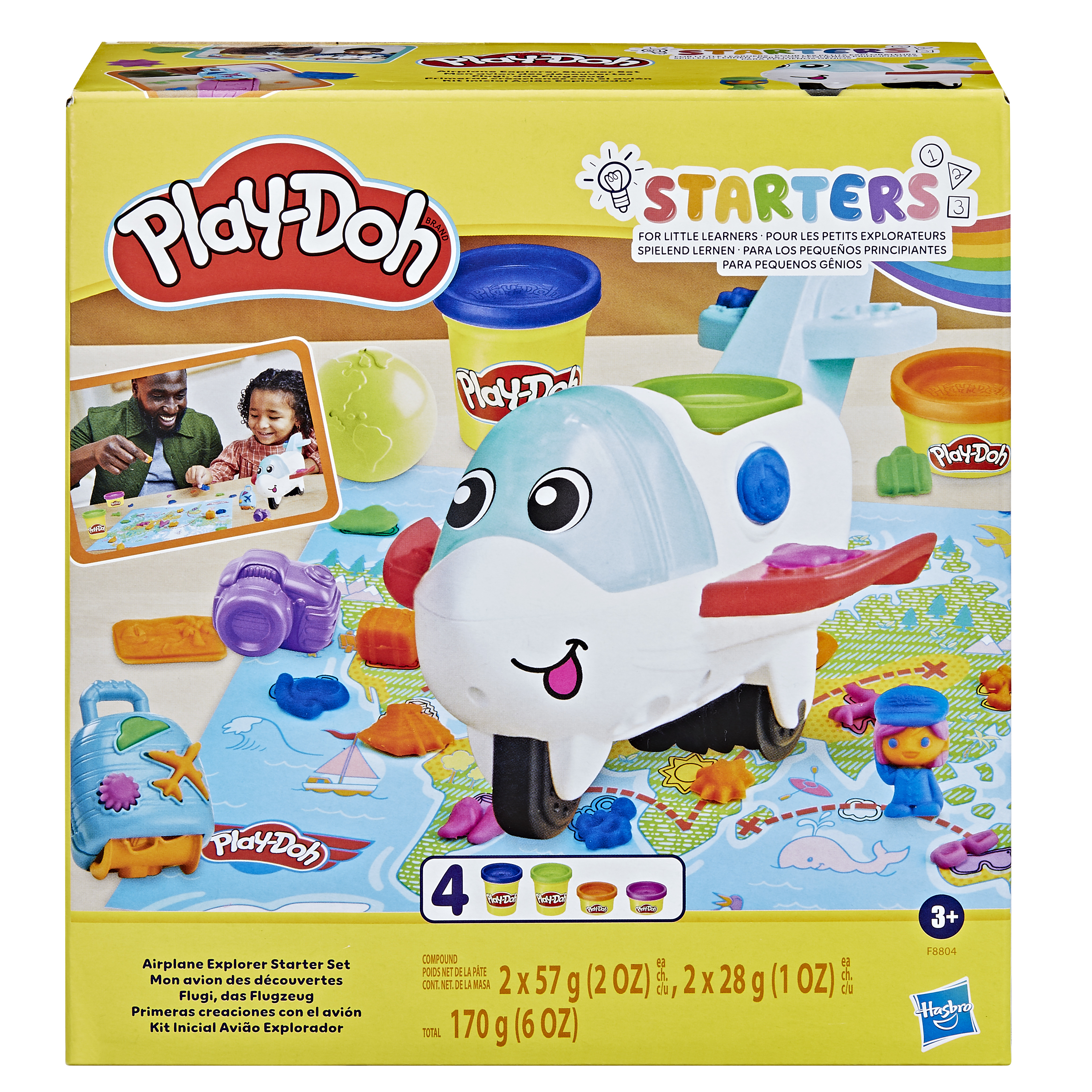 Caja del juego Play-Doh de avión. Cuenta con un avión de juguete, botes de Play-Doh y otros accesorios. La caja es amarilla.
