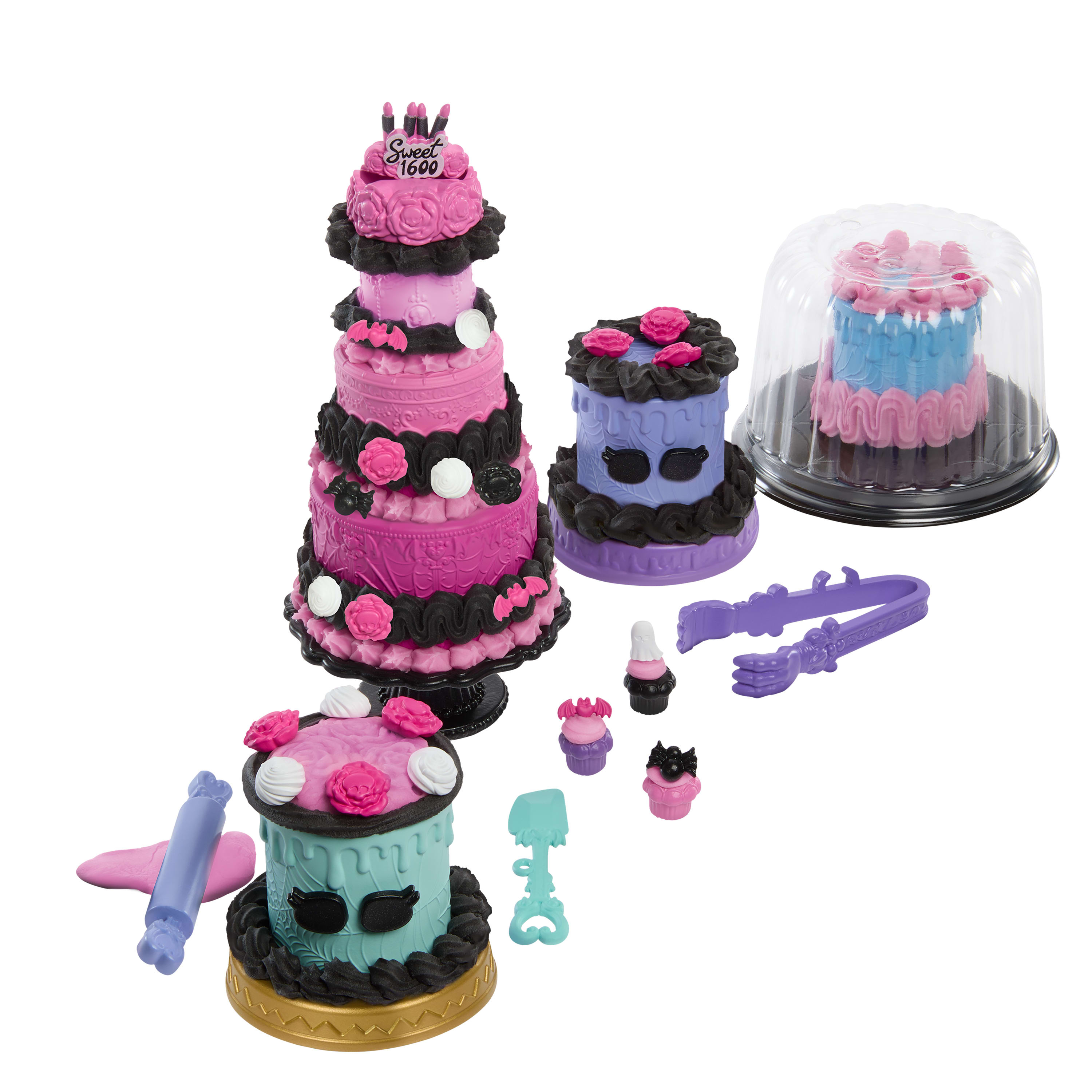 Un juego de pasteles de juguete y accesorios. Los pasteles son rosas, azules y morados con glaseado y decoraciones negras.