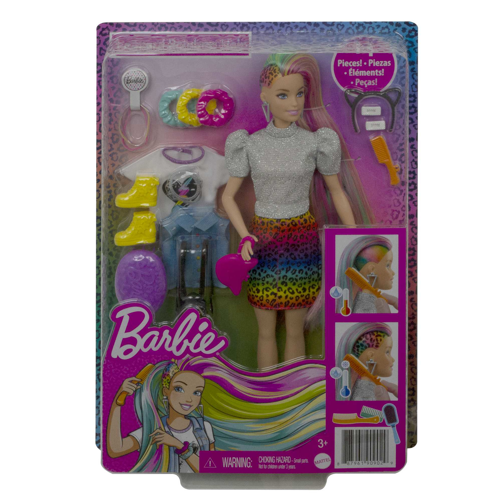 Barbie-Puppe in Verpackung. Puppe hat Regenbogenhaar, silbernes Hemd, Leopardenrock, Zubehör. Die Verpackung hat das Barbie-Logo und Zubehör.