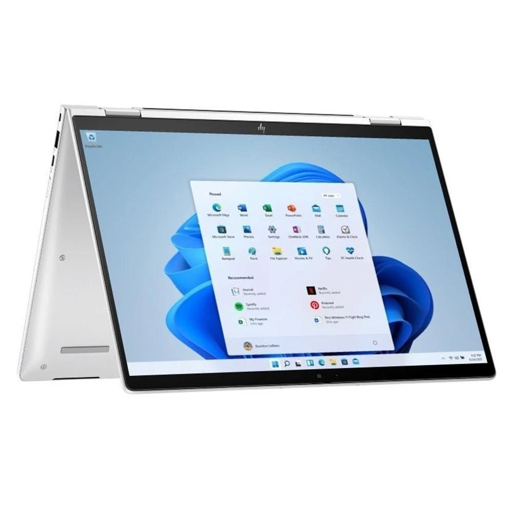 Un portátil HP plateado en modo tableta. La pantalla muestra el menú de inicio de Windows 11 con iconos de aplicaciones.