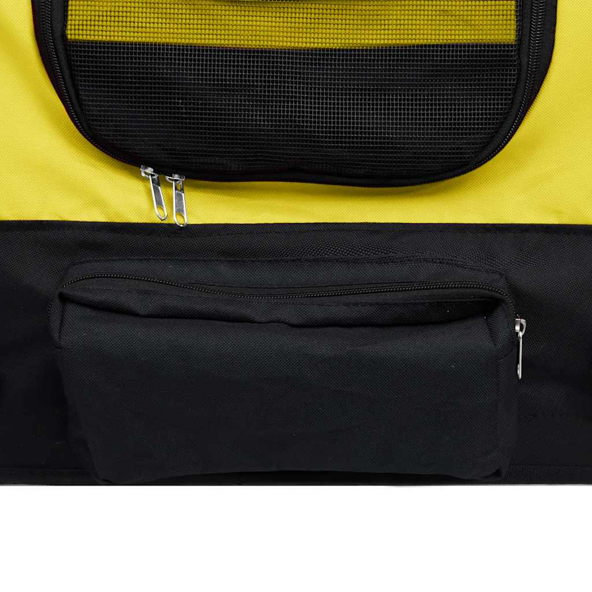 Nahaufnahme einer Haustiertasche. Die Oberseite ist gelb mit einem schwarzen Netzfenster. Die Unterseite ist schwarz mit einer Reißverschlusstasche.