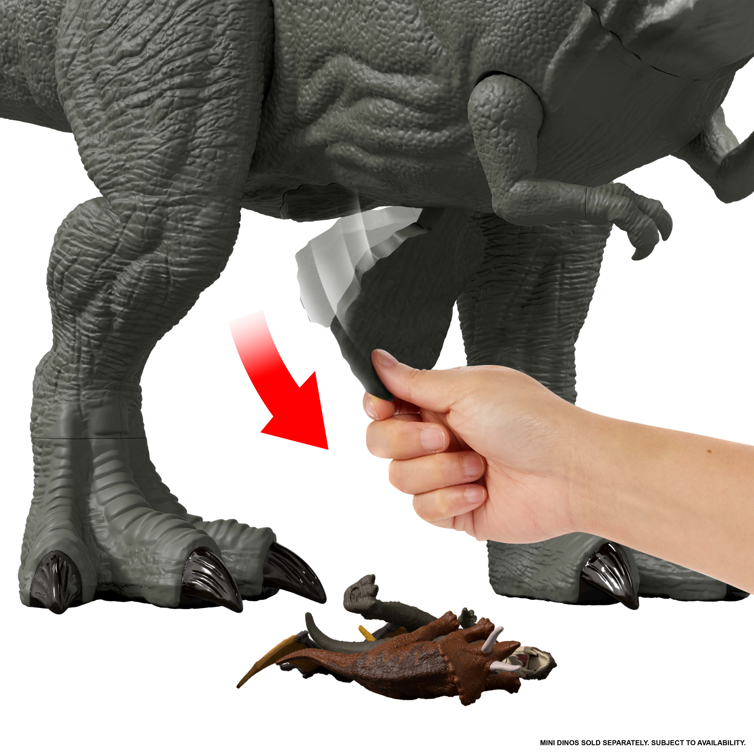 Eine Hand aktiviert das Bein eines Dinosaurierspielzeugs. Ein roter Pfeil zeigt die Aktion an. Mini-Dinosaurier befinden sich am Fuß.