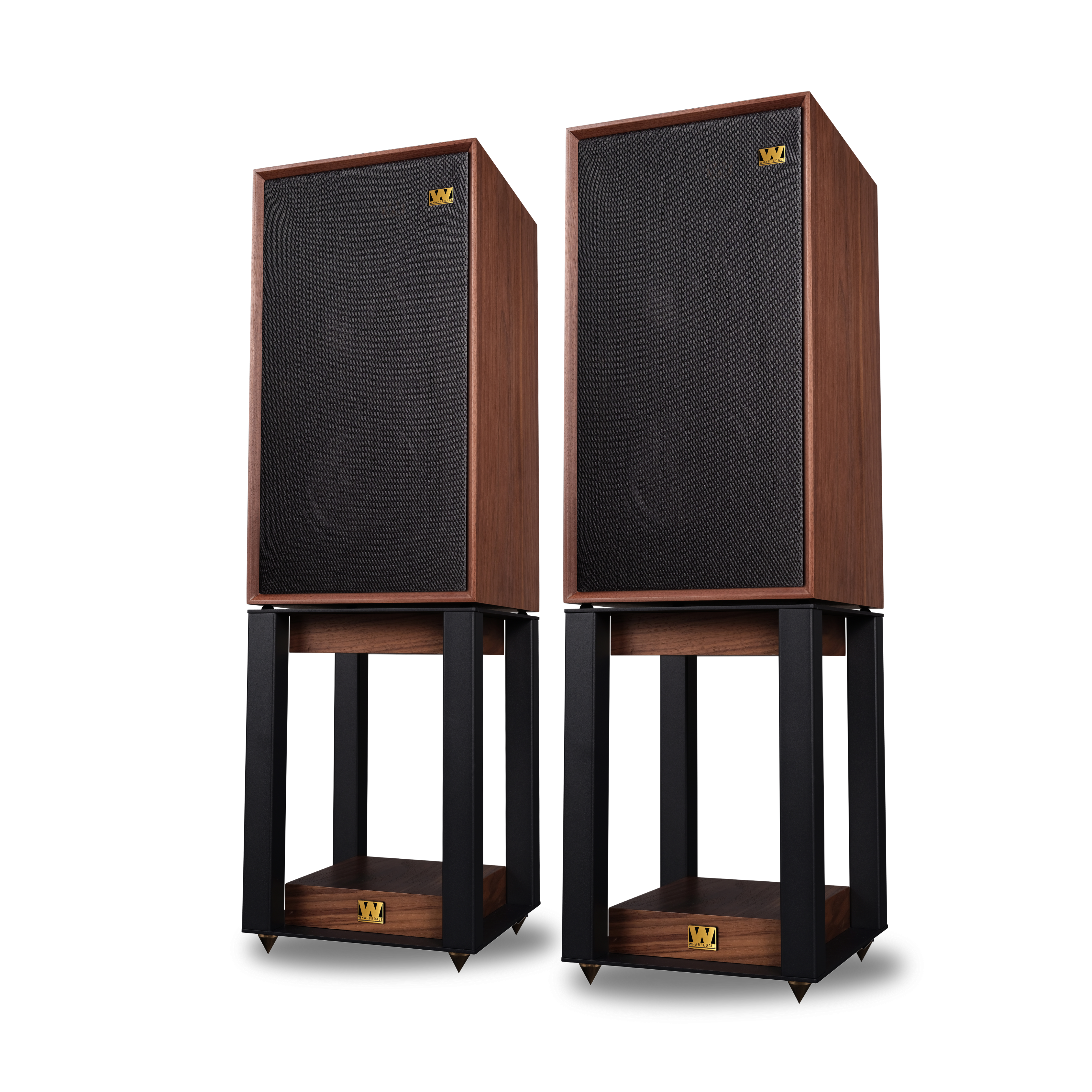Two wooden speakers with black mesh fronts sit on black stands with wooden bases. White background.