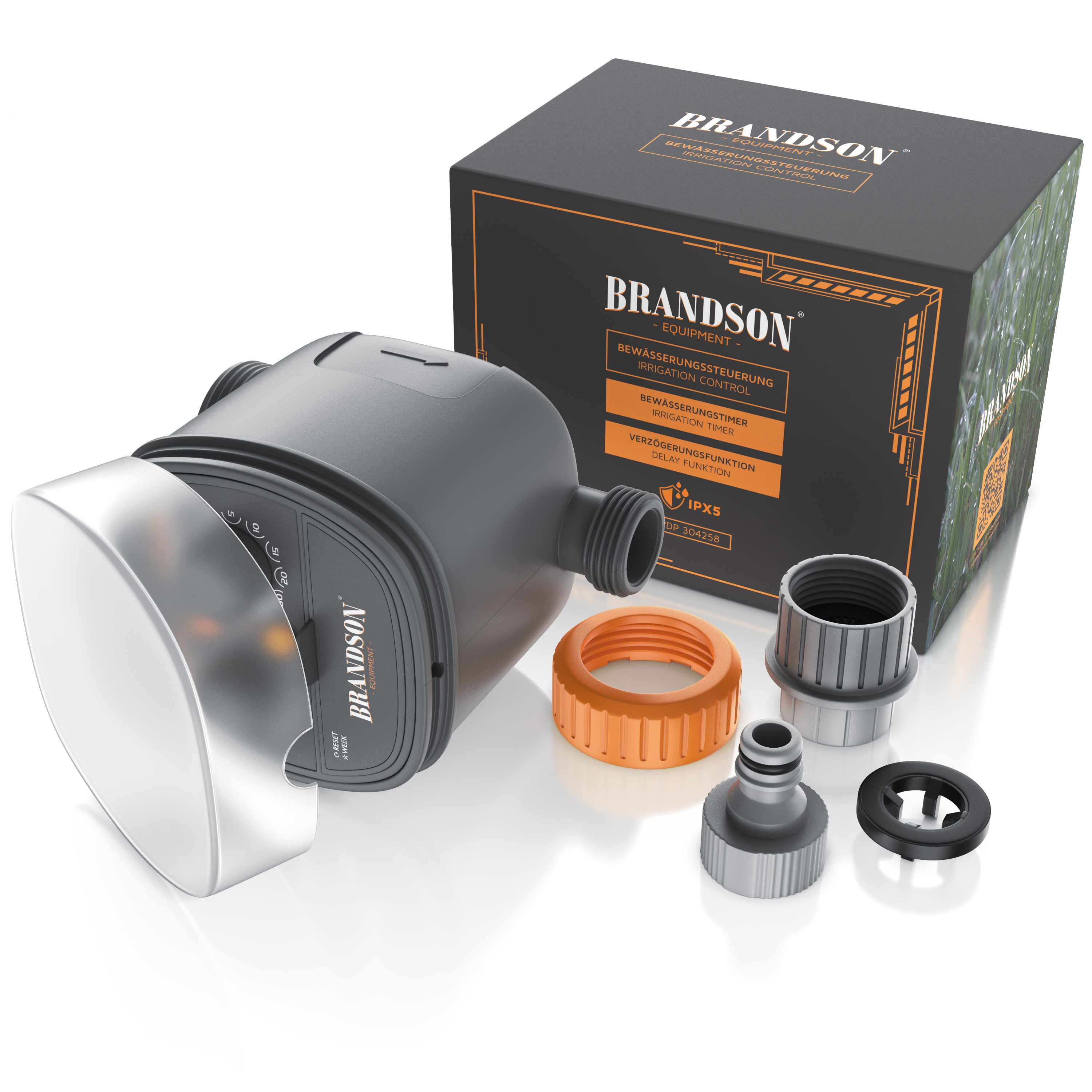 Ein grauer Bewässerungstimer mit Komponenten, darunter ein oranger Ring und eine Box, vor weißem Hintergrund.