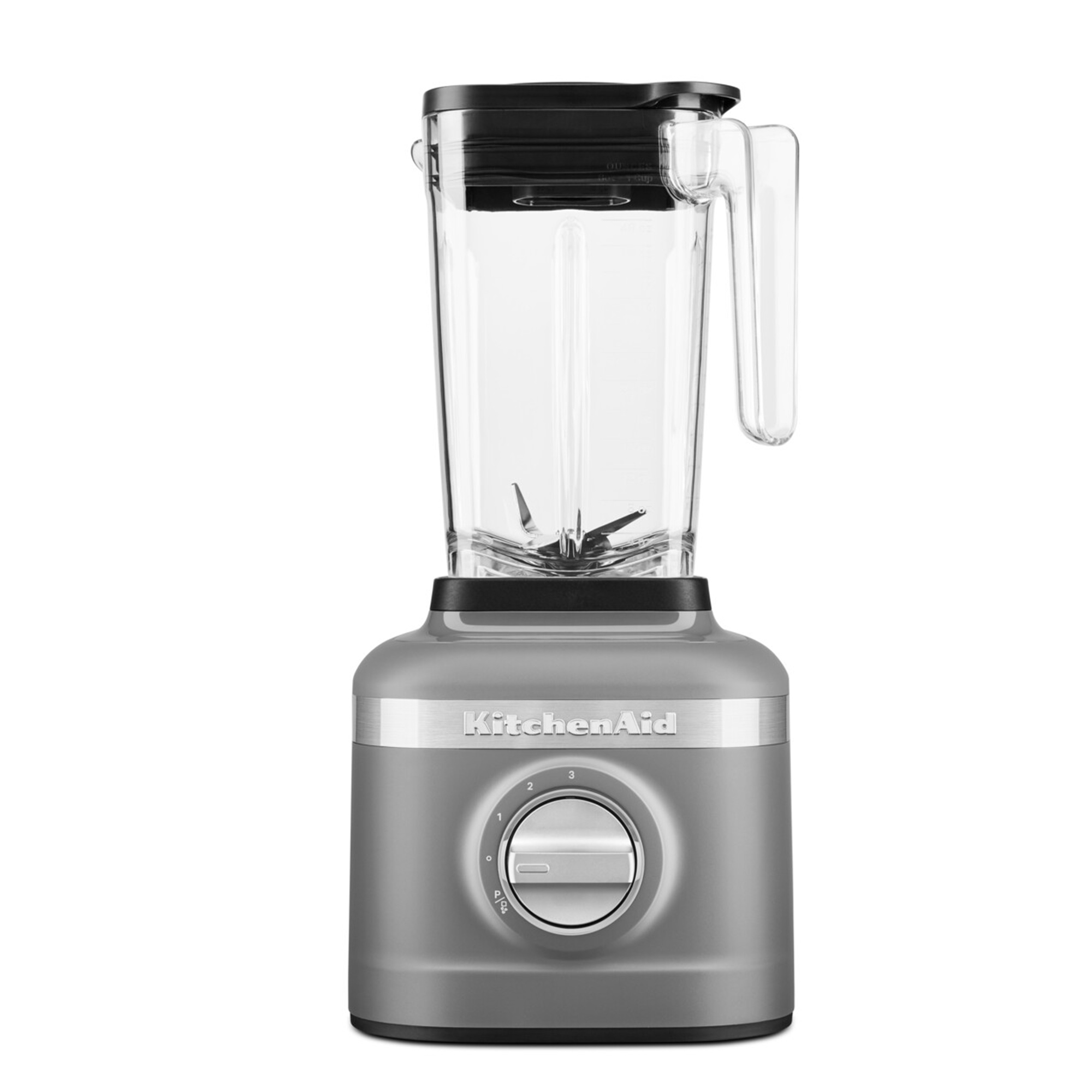 Szary blender KitchenAid ze szklanym dzbanem i czarną pokrywą. Pokrętło pokazuje ustawienia od 0 do 3.
