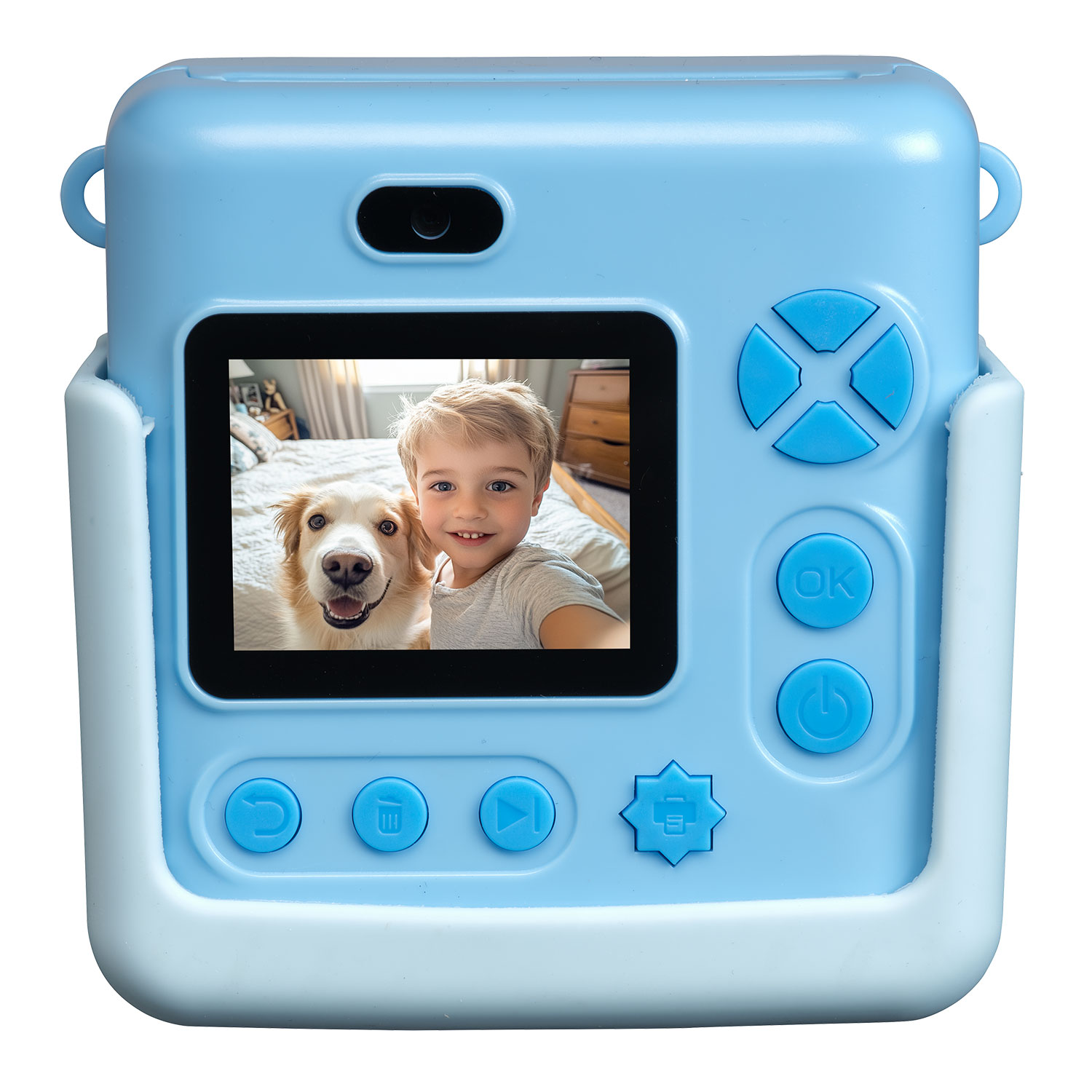 A blue camera displays a boy and dog selfie. The camera has buttons and a screen. The background is a bed.