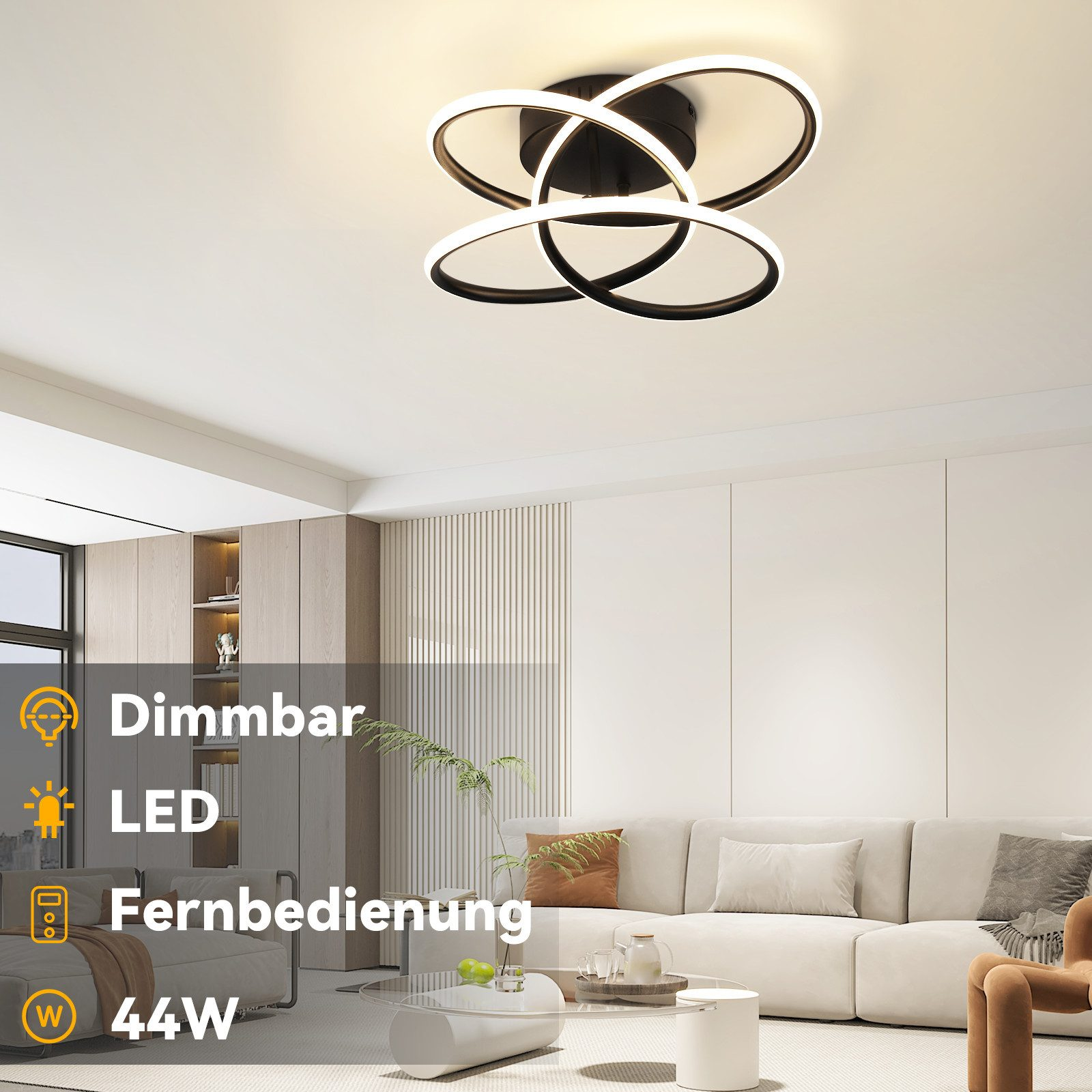 Un salón moderno con una lámpara de techo. La luz tiene tres anillos en blanco y negro. Hay un sofá y una mesa de centro en la habitación.