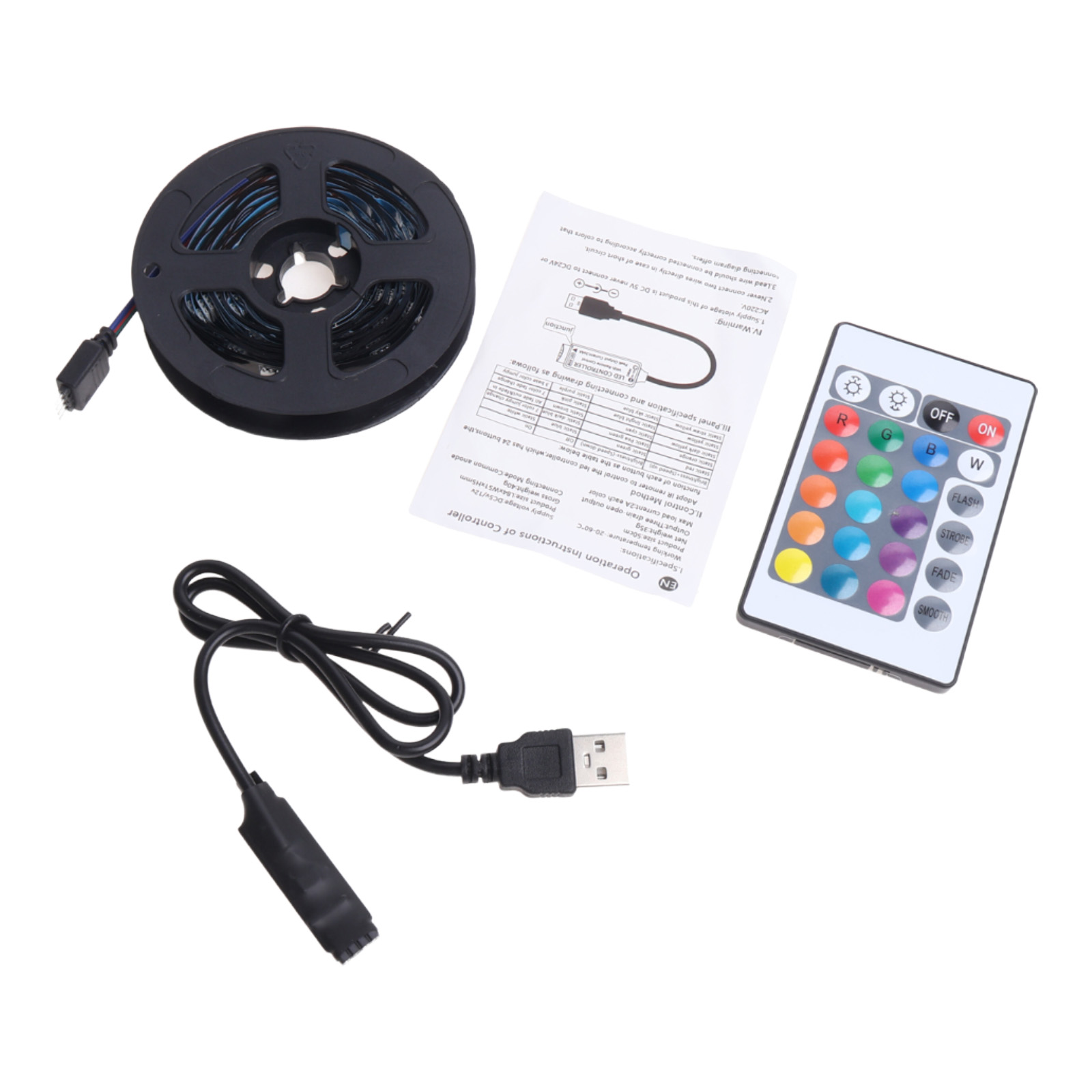LED-Streifenrolle, Fernbedienung, USB-Kabel und eine Anleitung liegen auf weißem Untergrund.