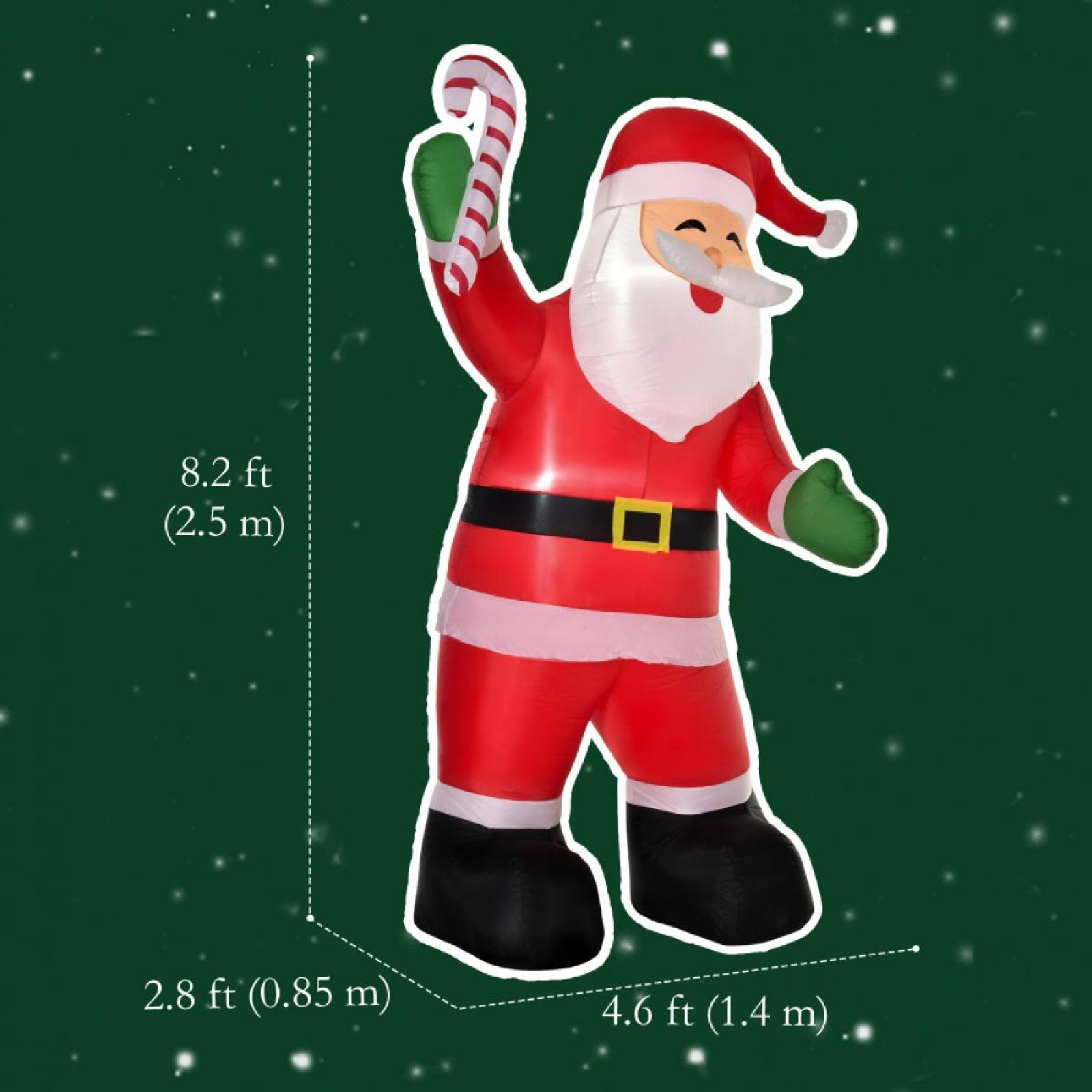 Ein aufblasbarer Weihnachtsmann mit einer Zuckerstange. Er ist rot, weiß und schwarz, vor einem grünen Hintergrund mit Schnee.