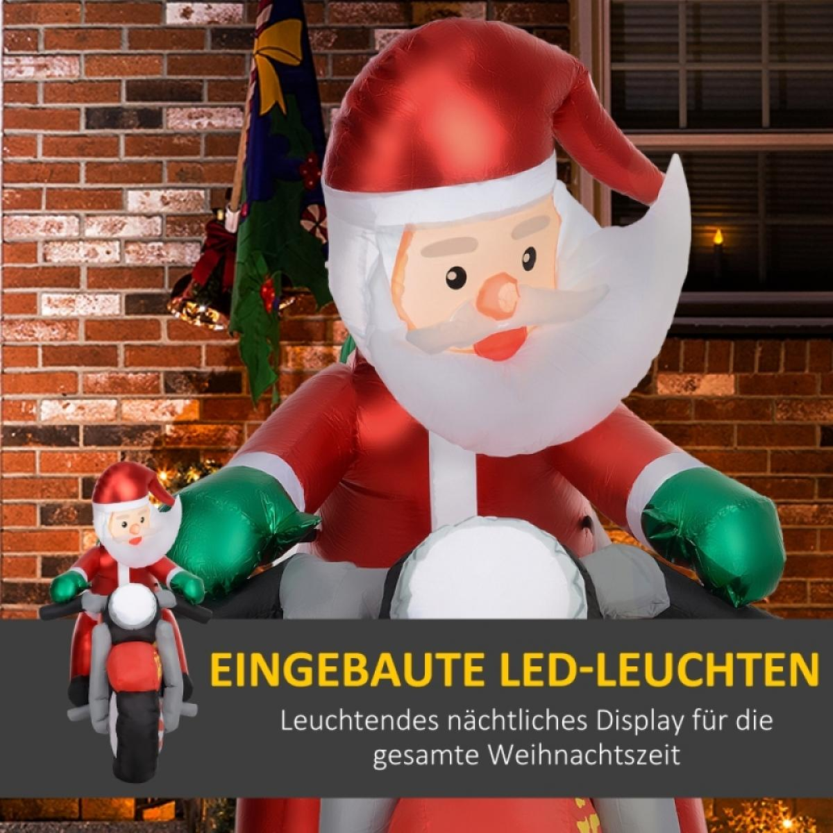 Aufblasbarer Weihnachtsmann auf Motorrad, roter Anzug, weißer Bart, grüne Handschuhe, Ziegelhintergrund. Text: Eingebaute LED-Leuchten.