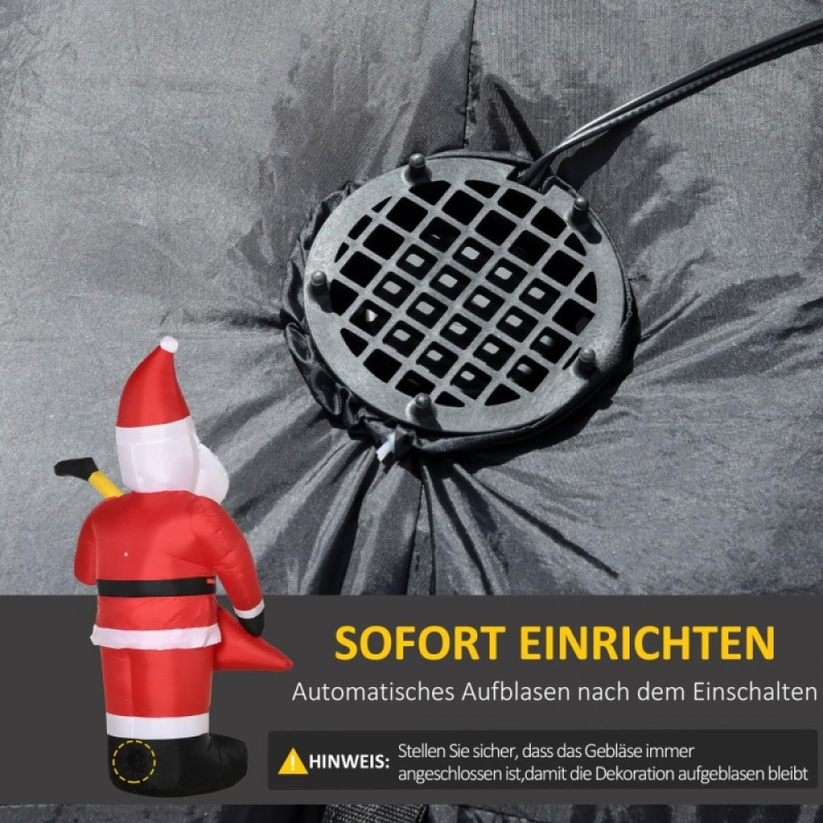 Ein aufblasbarer Weihnachtsmann mit einem schwarzen Ventilator und Netzkabel ist vor einem grauen Hintergrund mit deutschem Text zu sehen.