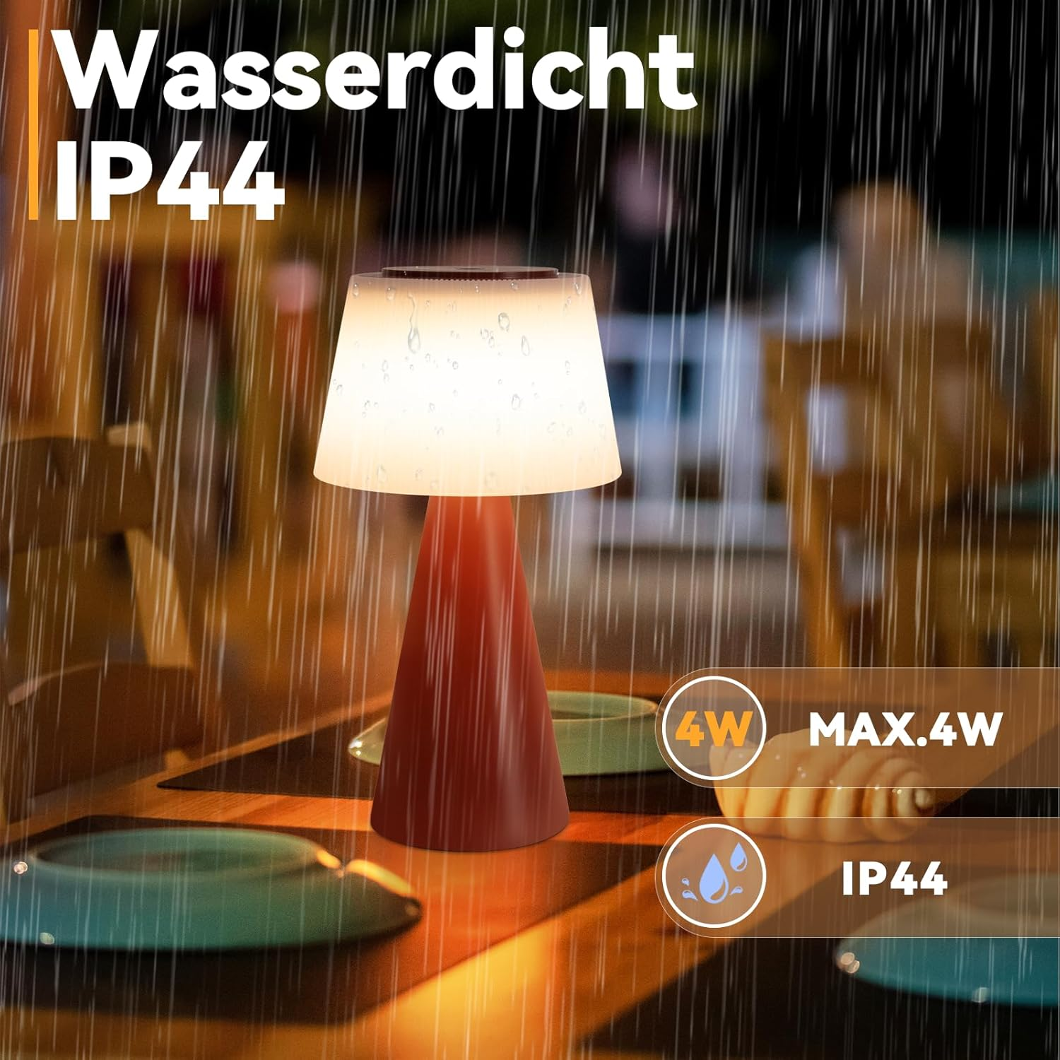 Una lampada da tavolo impermeabile con base rossa e paralume bianco. Piove. Il testo recita 'Wasserdicht IP44' e 'MAX.4W'.
