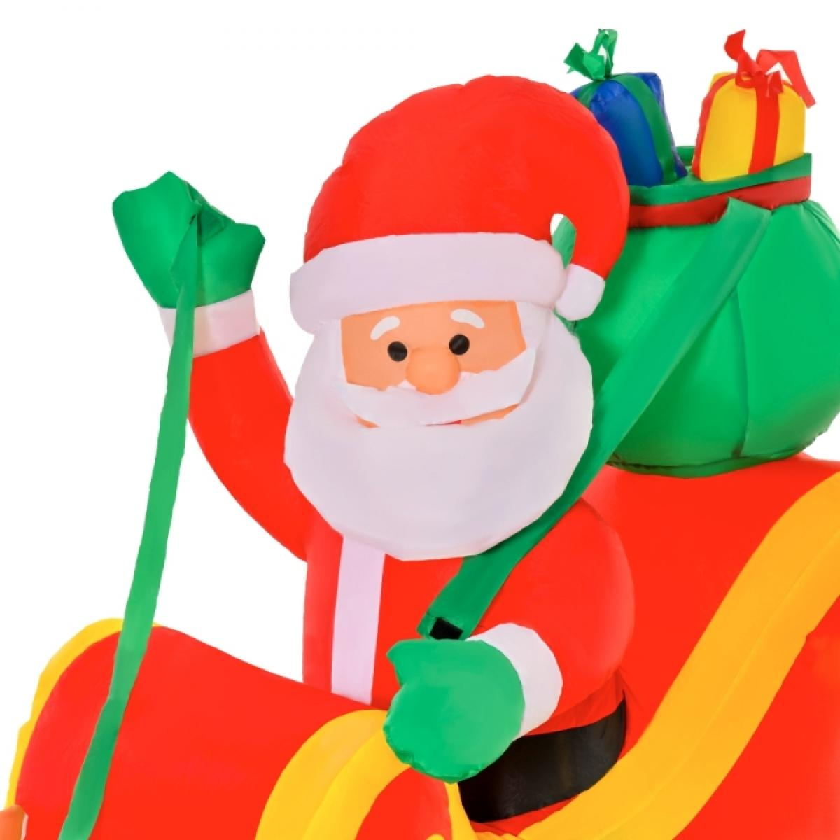 Aufblasbarer Weihnachtsmann mit rotem Anzug, weißem Bart, grüner Tasche voller Geschenke und grünen Bändern. Der Weihnachtsmann trägt einen roten Hut.