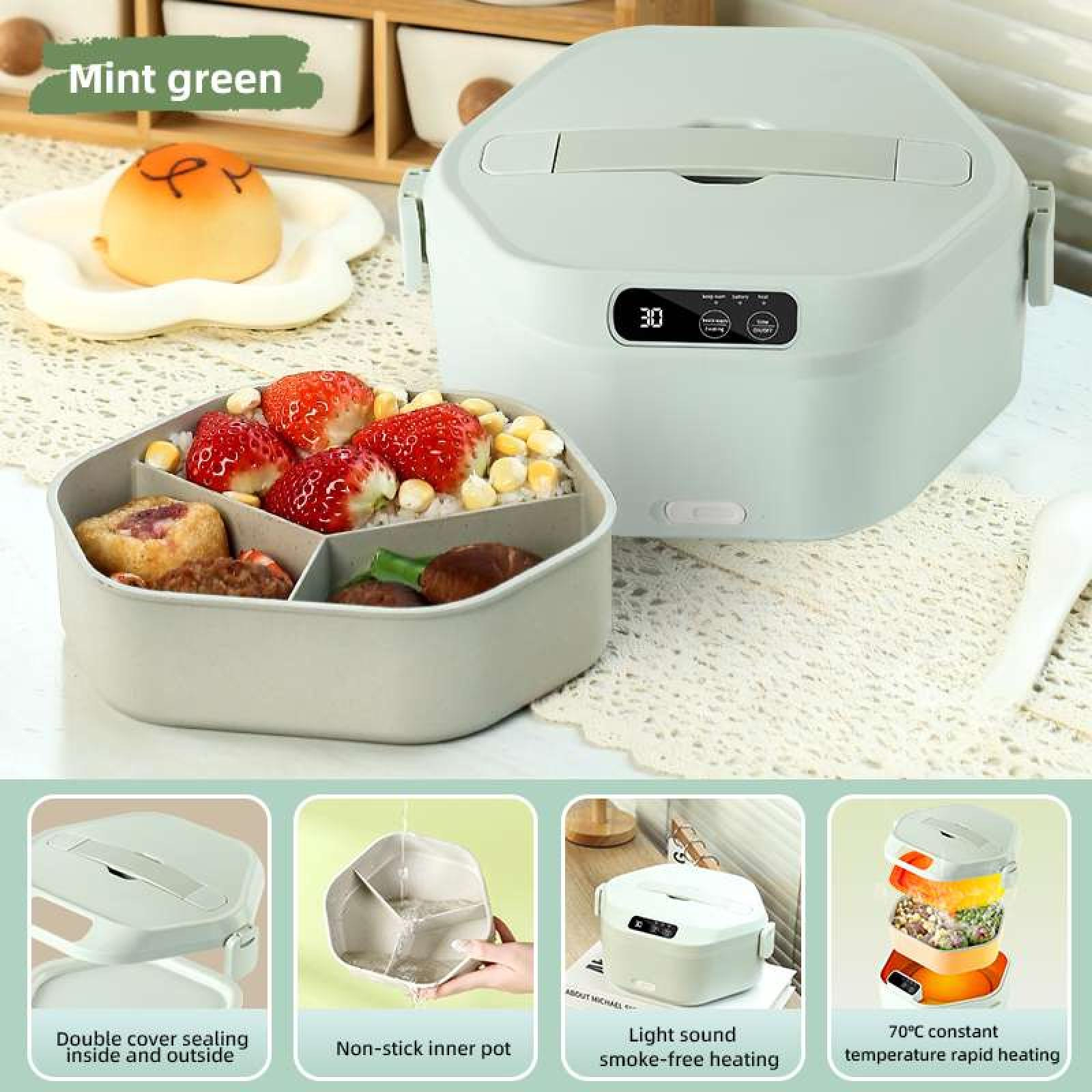 Eine mintgrüne Bento-Box mit Essen, einem Brötchen und anderen Lebensmitteln. Auf der Vorderseite befindet sich ein Digitaldisplay.