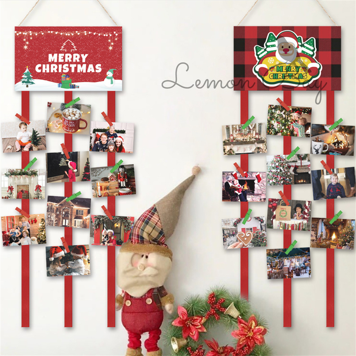 Weihnachtsdekoration mit Fotoanzeigen, Santa-Puppe, Kranz. Fotos auf roten Bändern befestigt, festliche Schilder. Weißer Wandhintergrund.