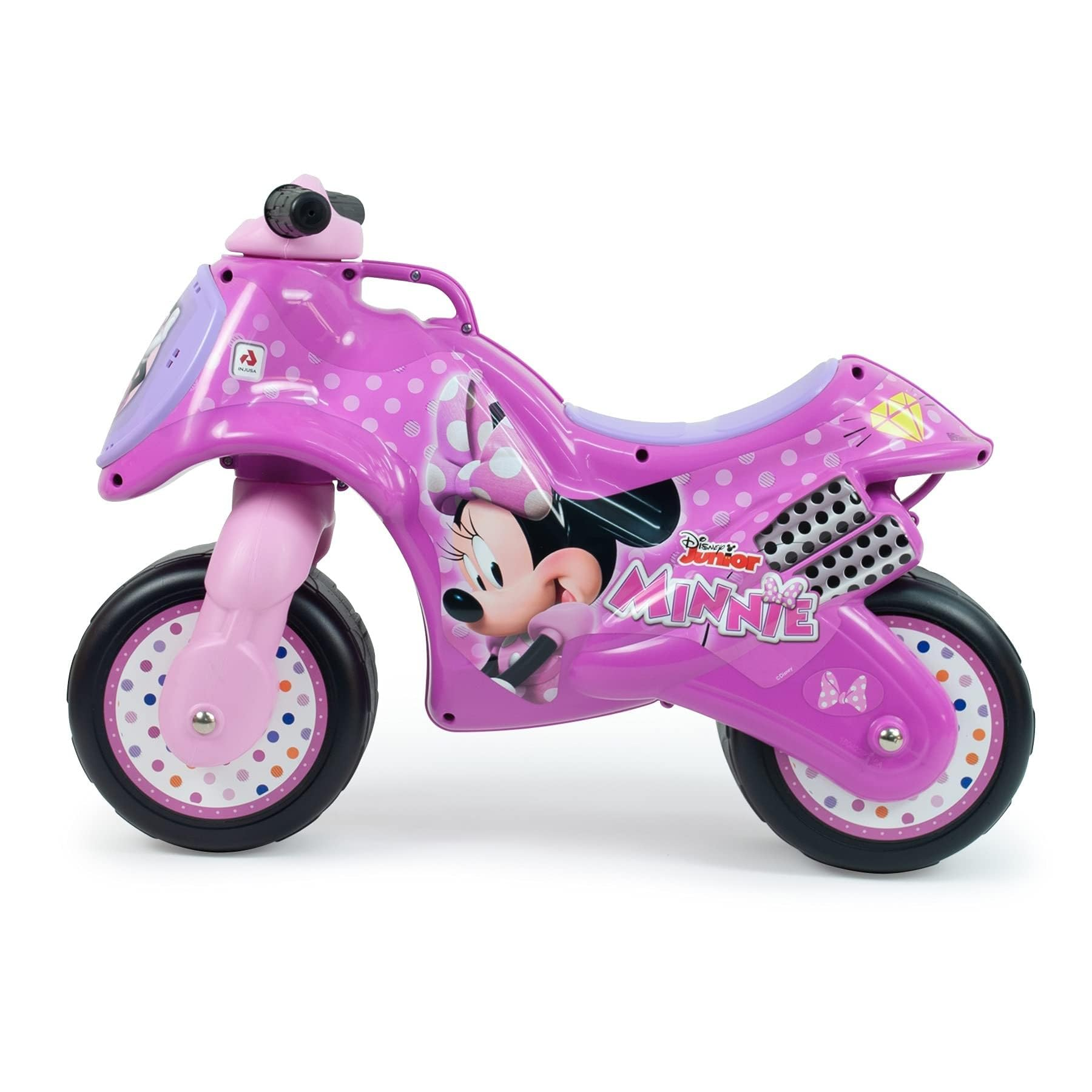 Una moto de juguete rosa de Minnie Mouse. Tiene neumáticos negros, asiento morado y gráficos de Minnie Mouse.
