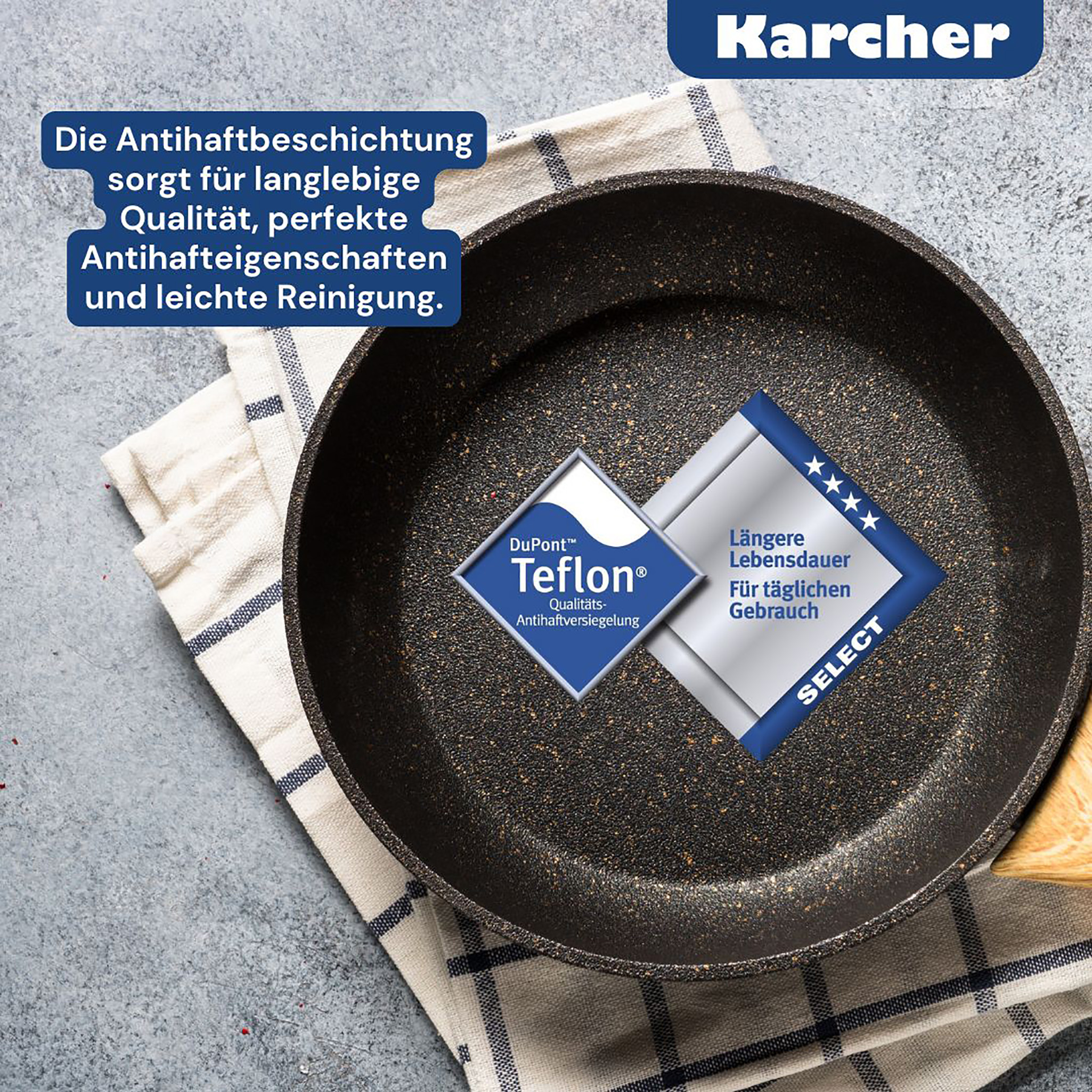 Eine Bratpfanne mit Teflonbeschichtung, ein weißes Tuch und Textetiketten. Die Pfanne steht auf einer grauen Oberfläche.