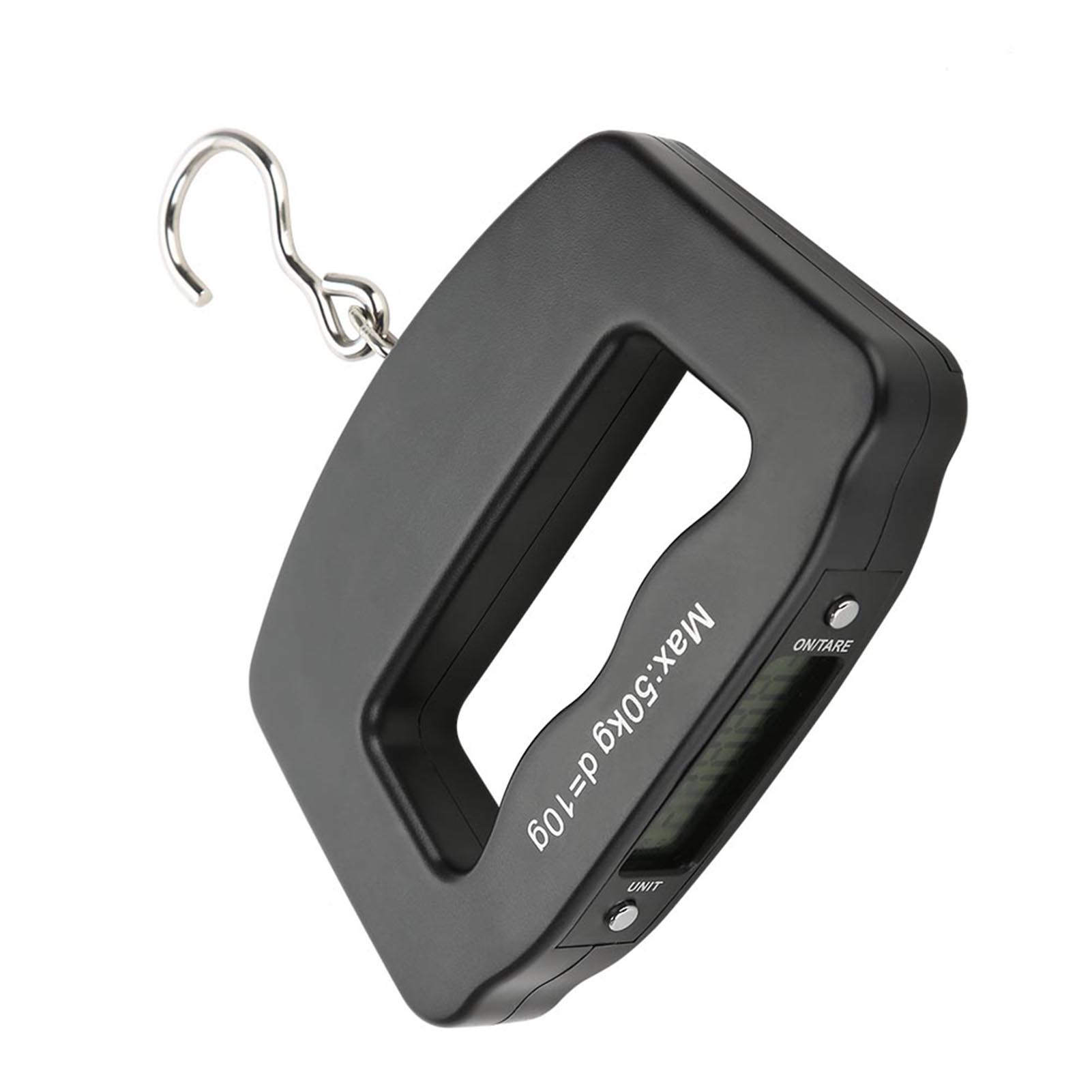 Eine schwarze digitale Hängewaage mit Metallhaken. Die Waage zeigt 'Max:50kg d=10g' und hat Tasten für 'ON/TARE' und 'UNIT'.