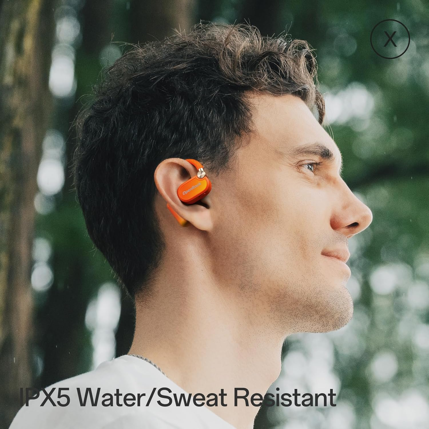Man wearing orange earbuds. Text says 'IPX5 Water/Sweat Resistant.' The background is blurry green, with water droplets visible.