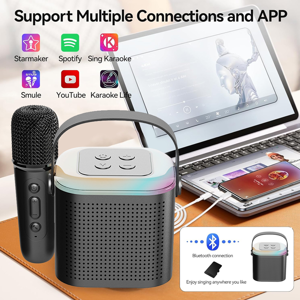 Ein Karaoke-Lautsprecher mit Mikrofon. Apps wie Spotify und YouTube sind mit Laptop und Smartphone verbunden.