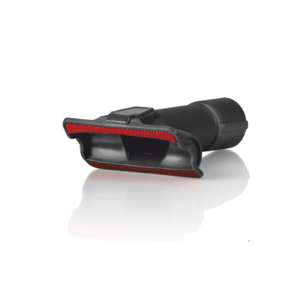 Czarny osprzęt do odkurzacza z czerwoną szczotką. Leży na białej powierzchni z lekkim odbiciem.