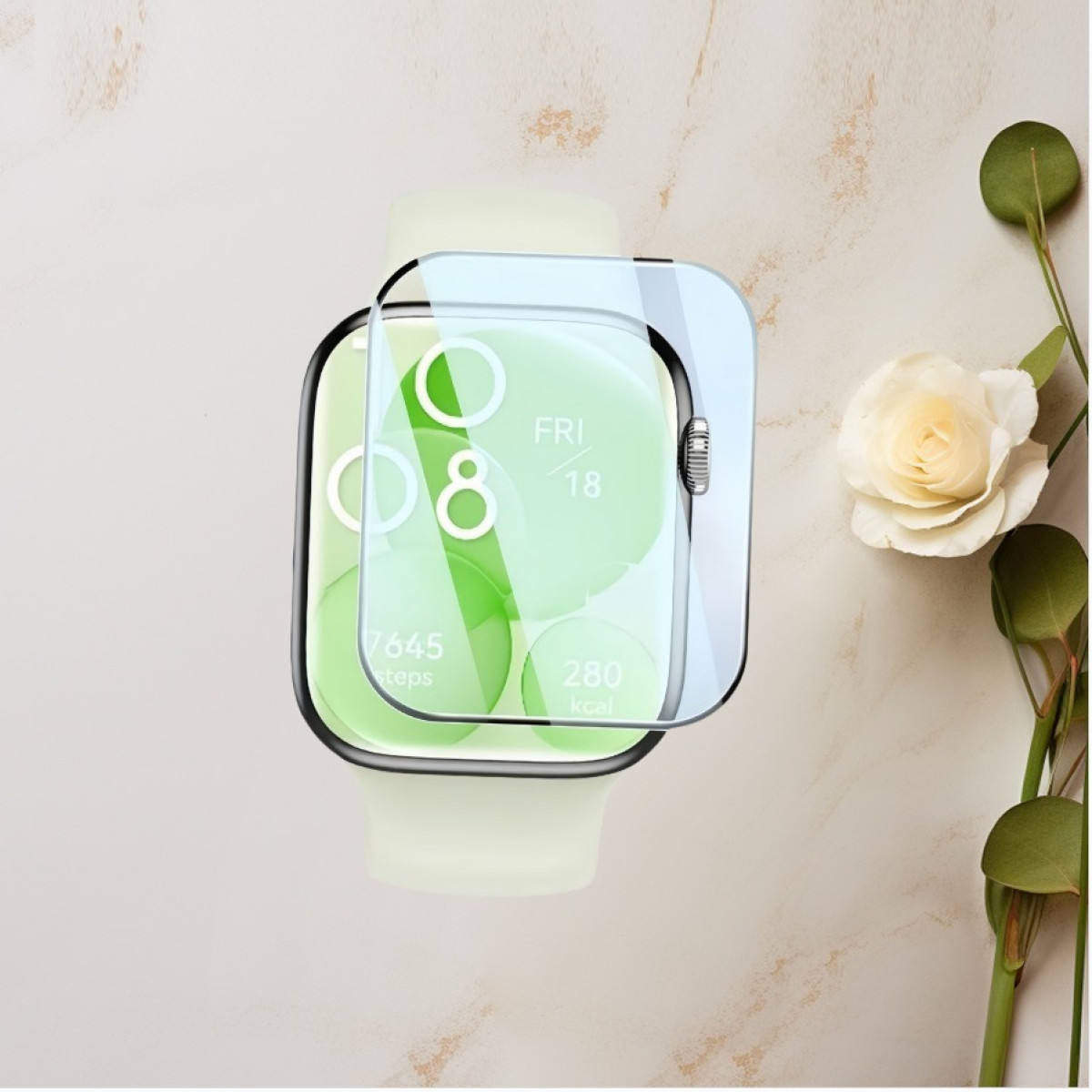 Uno smartwatch con protezione schermo. L'orologio mostra dati e ha uno schermo verde chiaro. Una rosa bianca e foglie sullo sfondo.