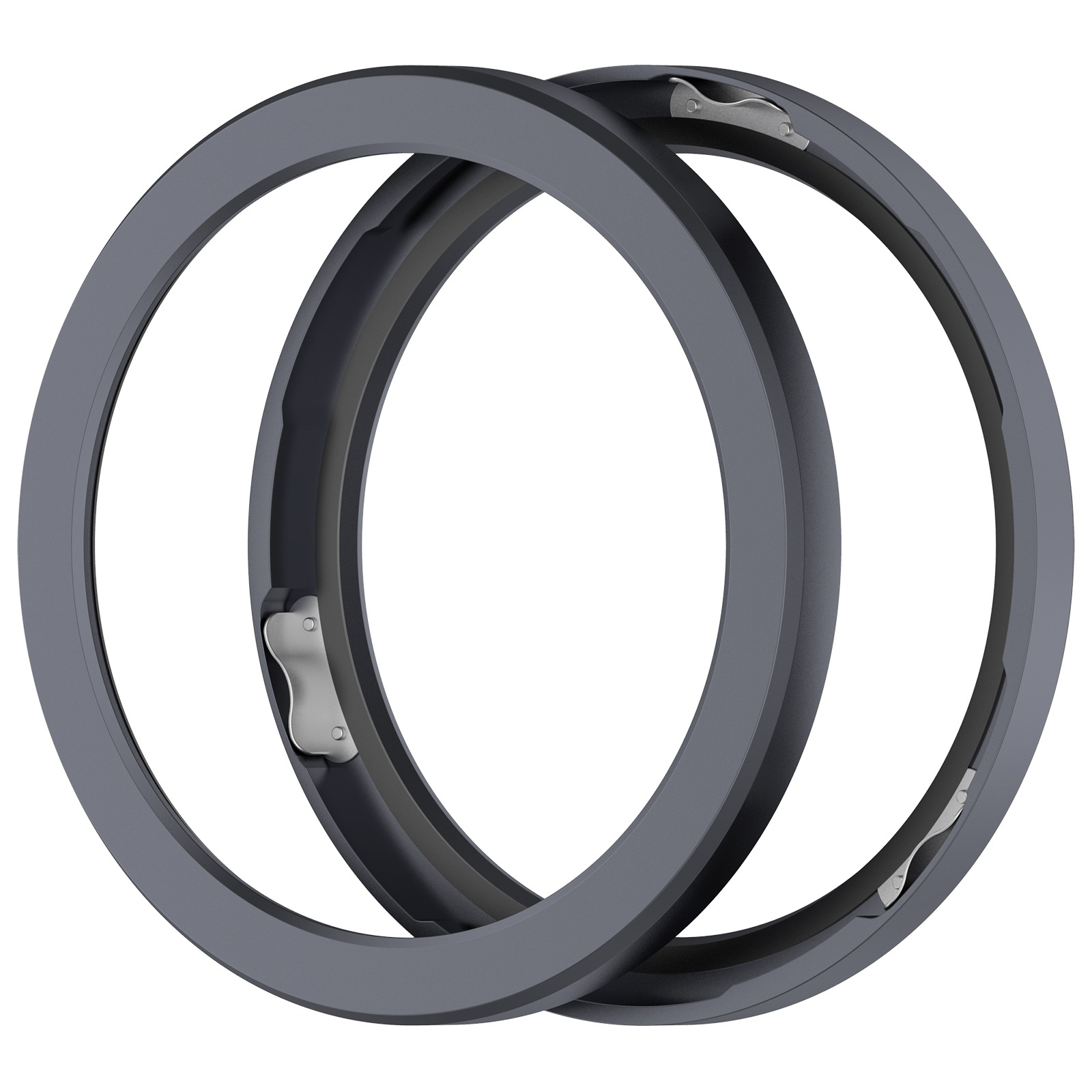 Due oggetti circolari grigio scuro sovrapposti con clip metalliche argentate su sfondo bianco.