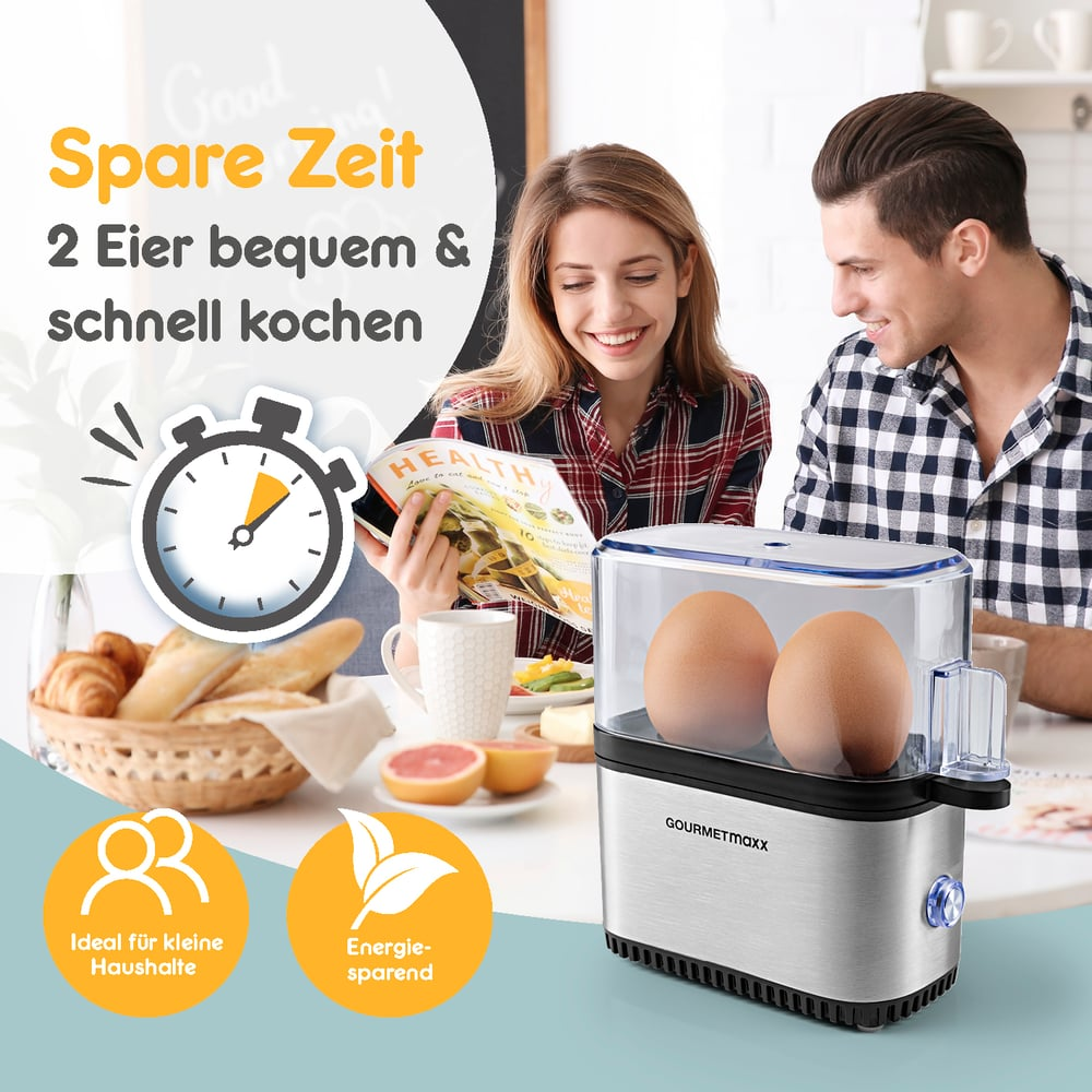 Para uśmiecha się, czytając czasopismo, obok urządzenia do gotowania jajek z dwoma jajkami. Tekst: Spare Zeit, 2 Eier bequem & schnell kochen.