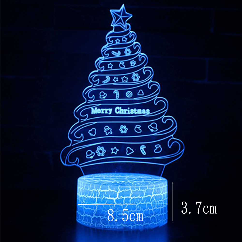 Ein blau leuchtender Weihnachtsbaumschmuck mit Stern. Er sagt Frohe Weihnachten. Die Basis ist 8,5 cm breit und 3,7 cm hoch.
