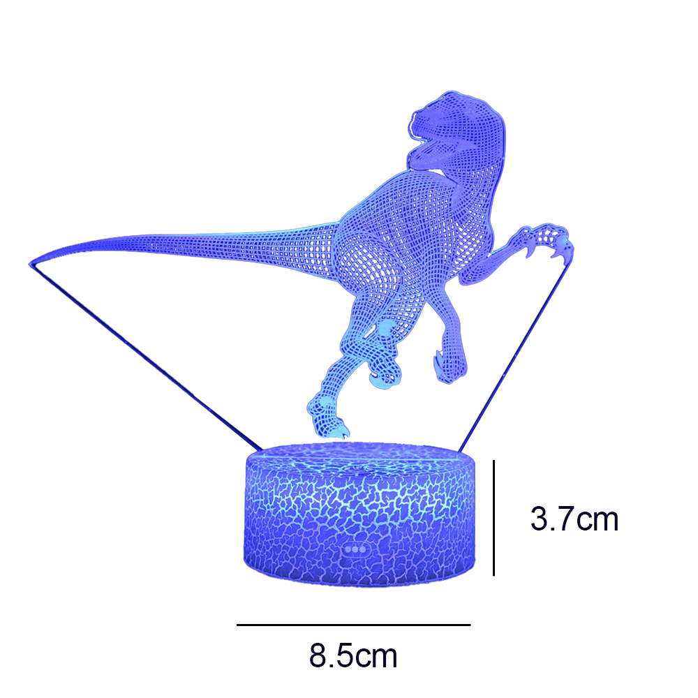 Eine blaue Drahtgitter-Dinosaurierlampe. Der Dinosaurier steht auf einem gemusterten Sockel. Abmessungen: 8,5 cm breit, 3,7 cm hoch.