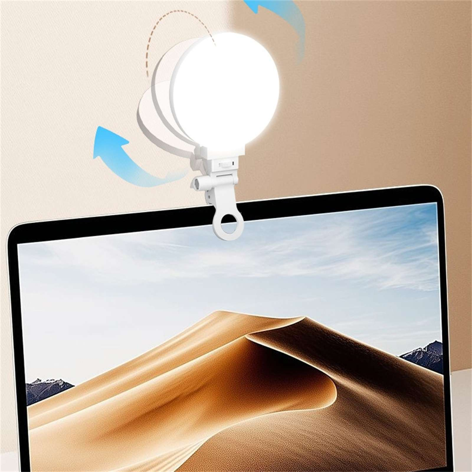 Ein weißes LED-Ringlicht ist an einem Laptop befestigt. Der Bildschirm zeigt eine Wüstenlandschaft. Blaue Pfeile zeigen die Lichteinstellung an.